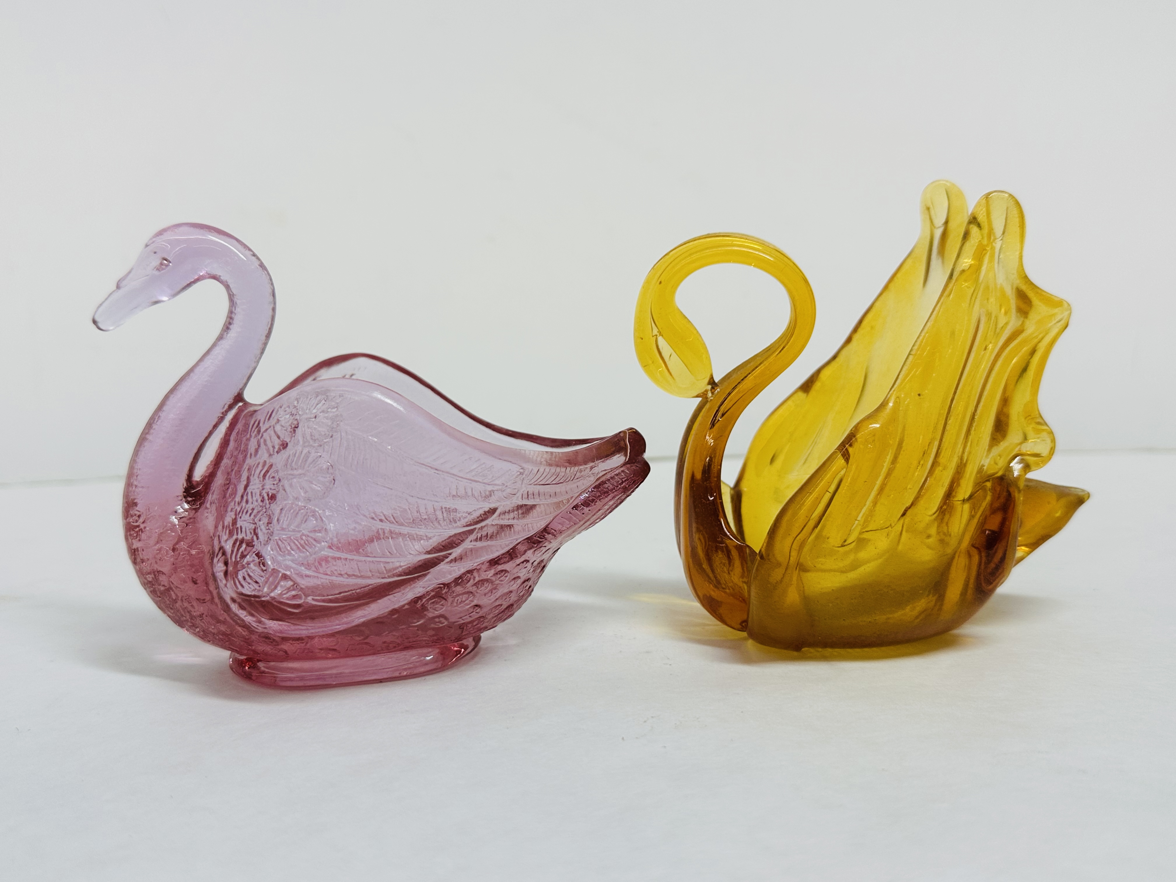 FENTON AND AMBER GLASS SWANS, 1999