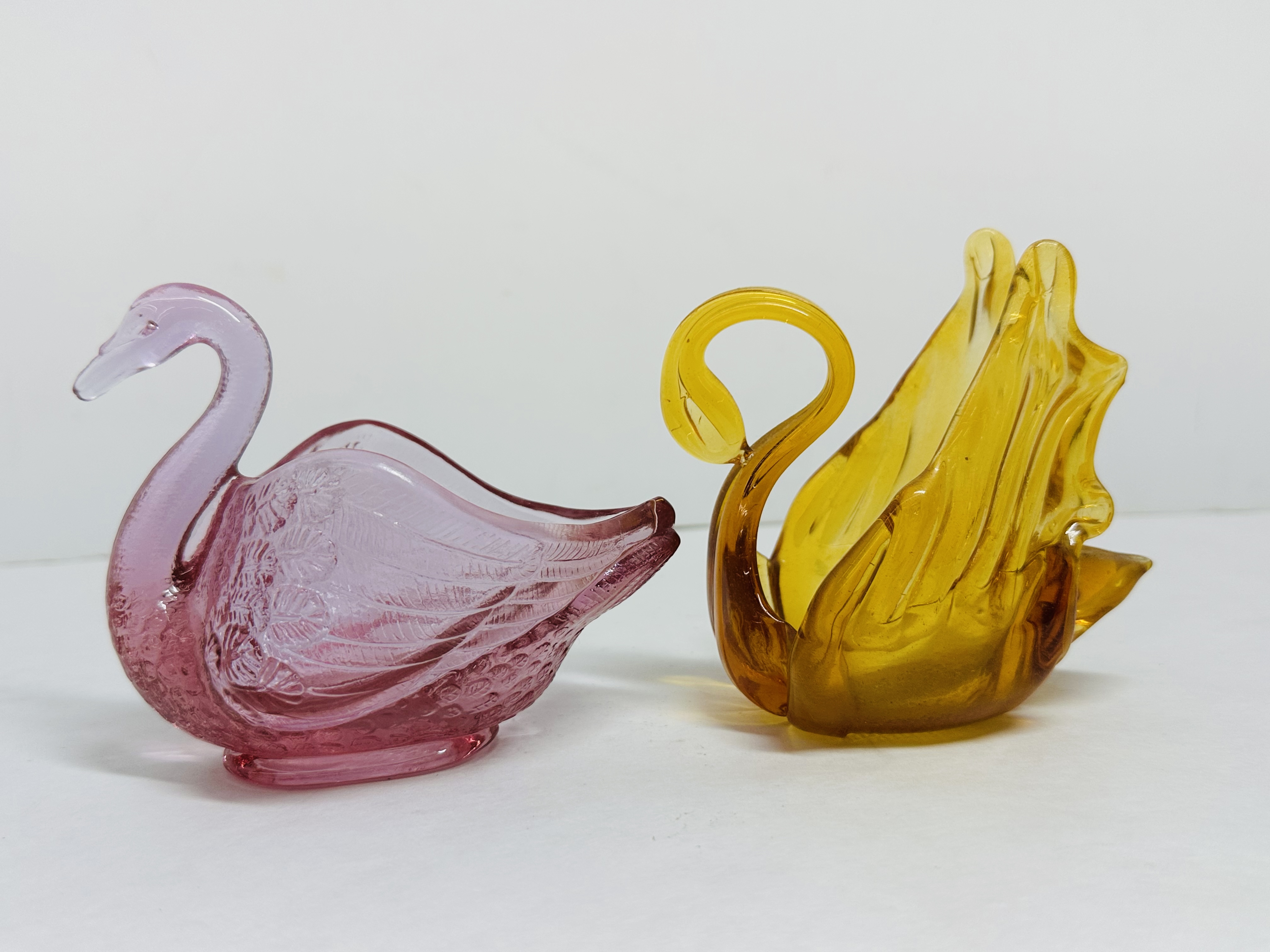 FENTON AND AMBER GLASS SWANS, 1999