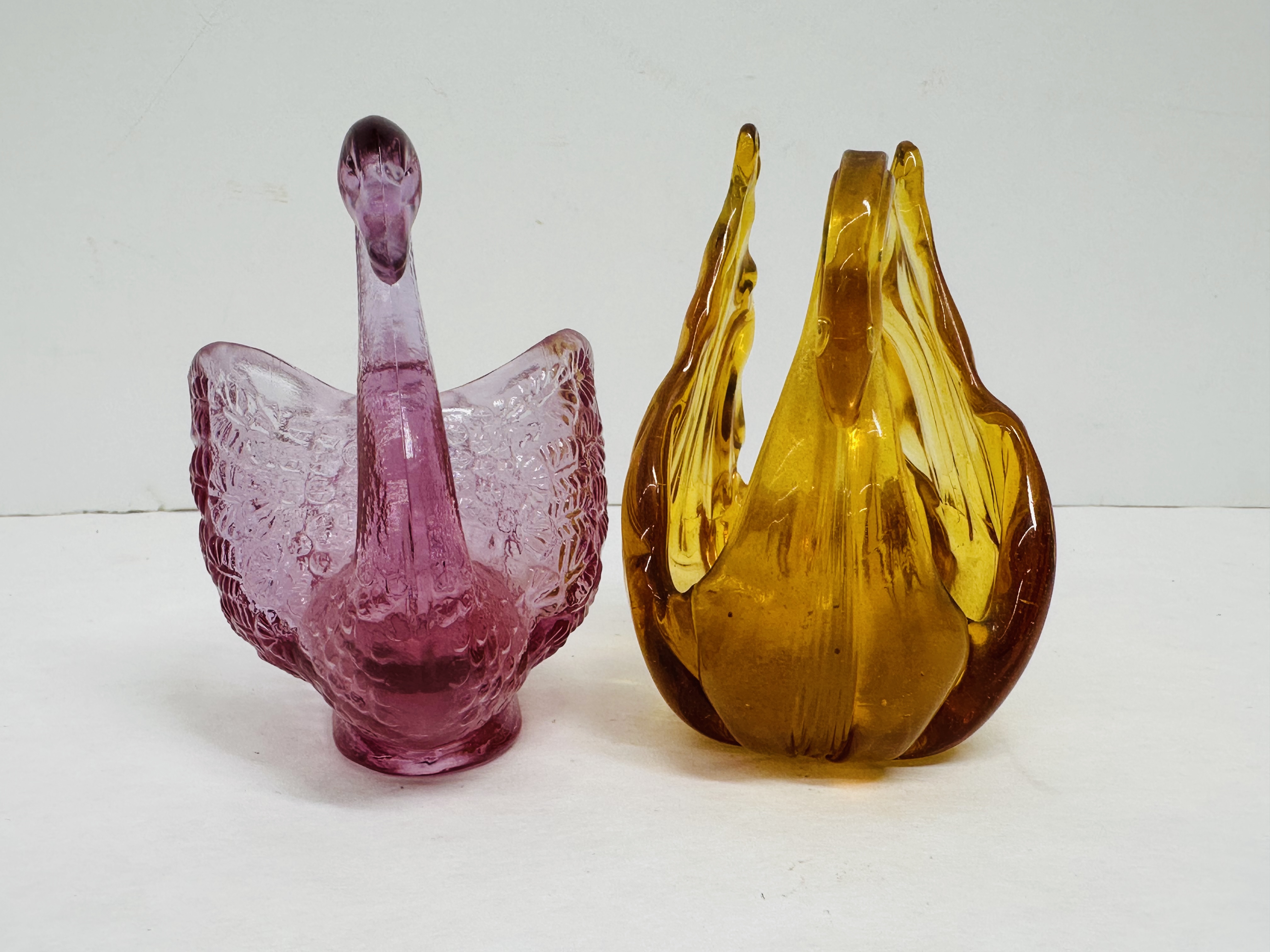 FENTON AND AMBER GLASS SWANS, 1999