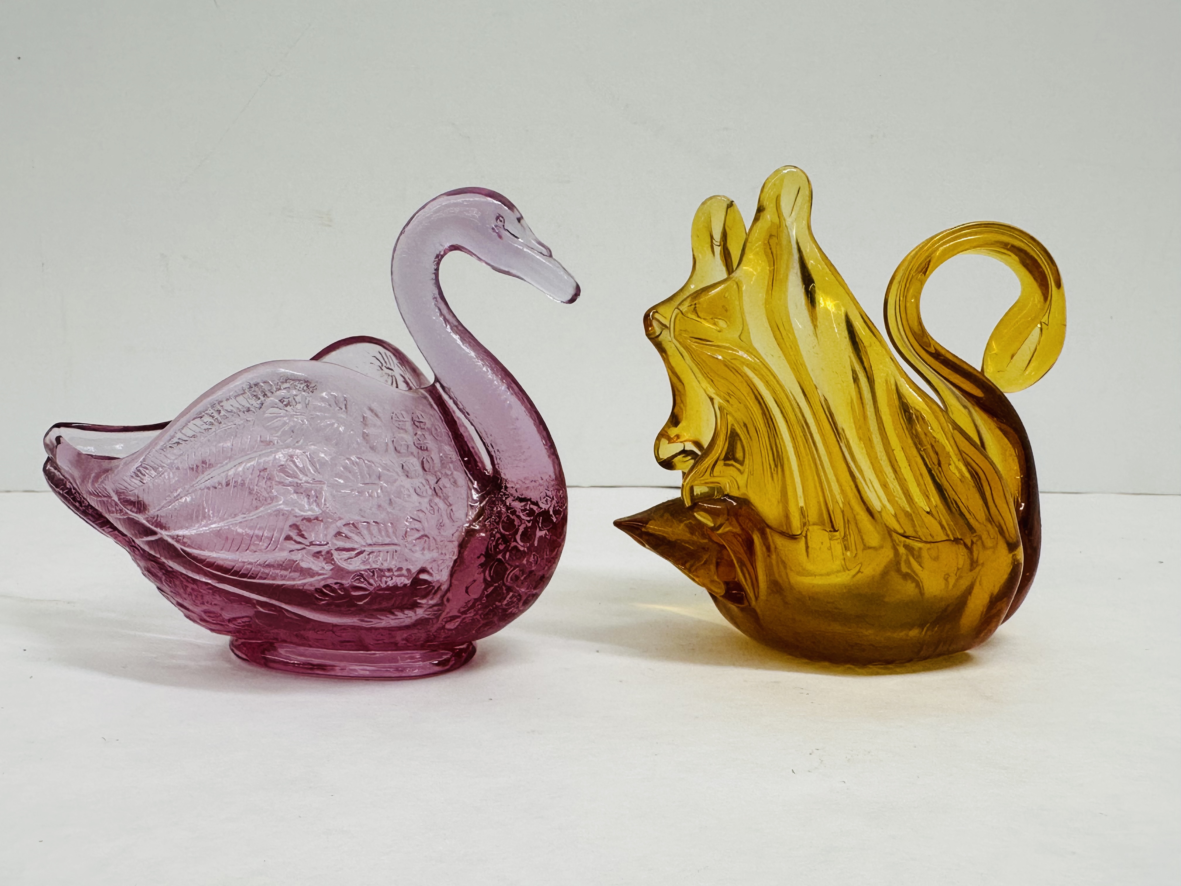 FENTON AND AMBER GLASS SWANS, 1999