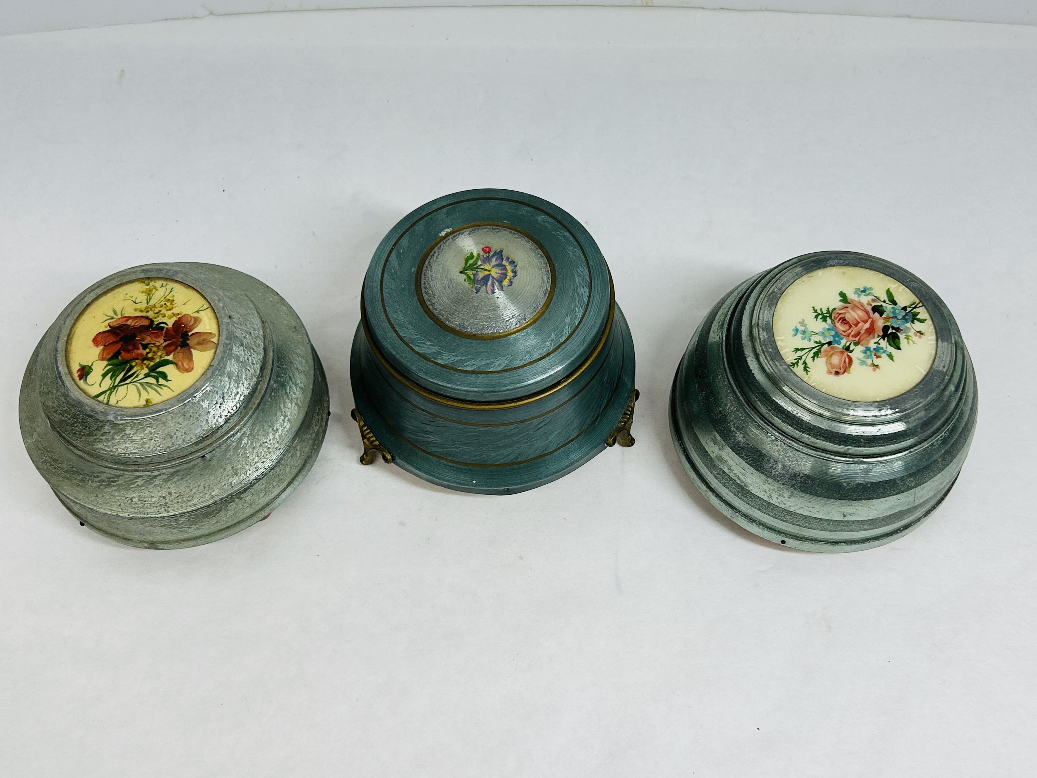 THREE ALUMINUM MUSICAL POWDER BOXES, C. 1940