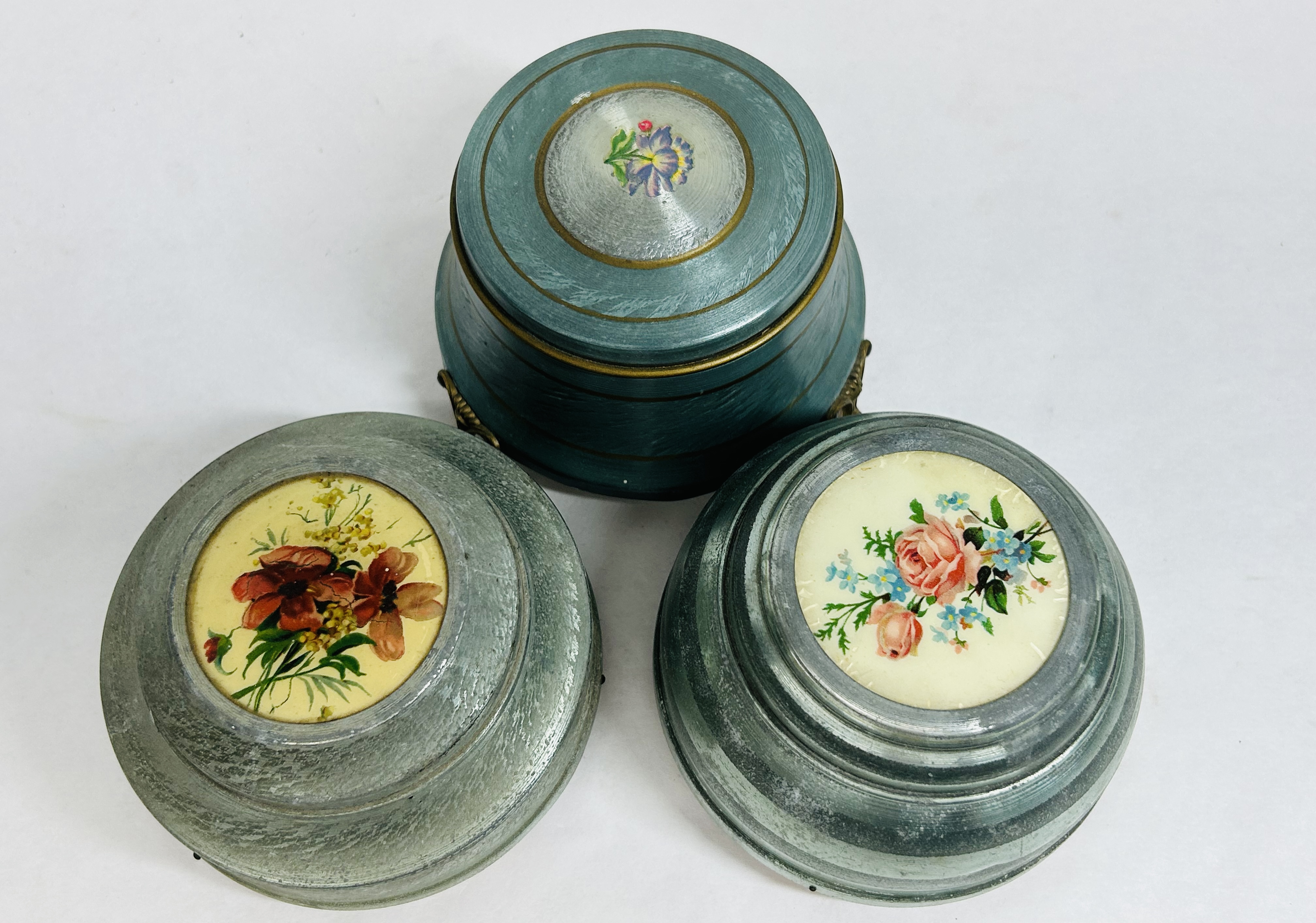 THREE ALUMINUM MUSICAL POWDER BOXES, C. 1940