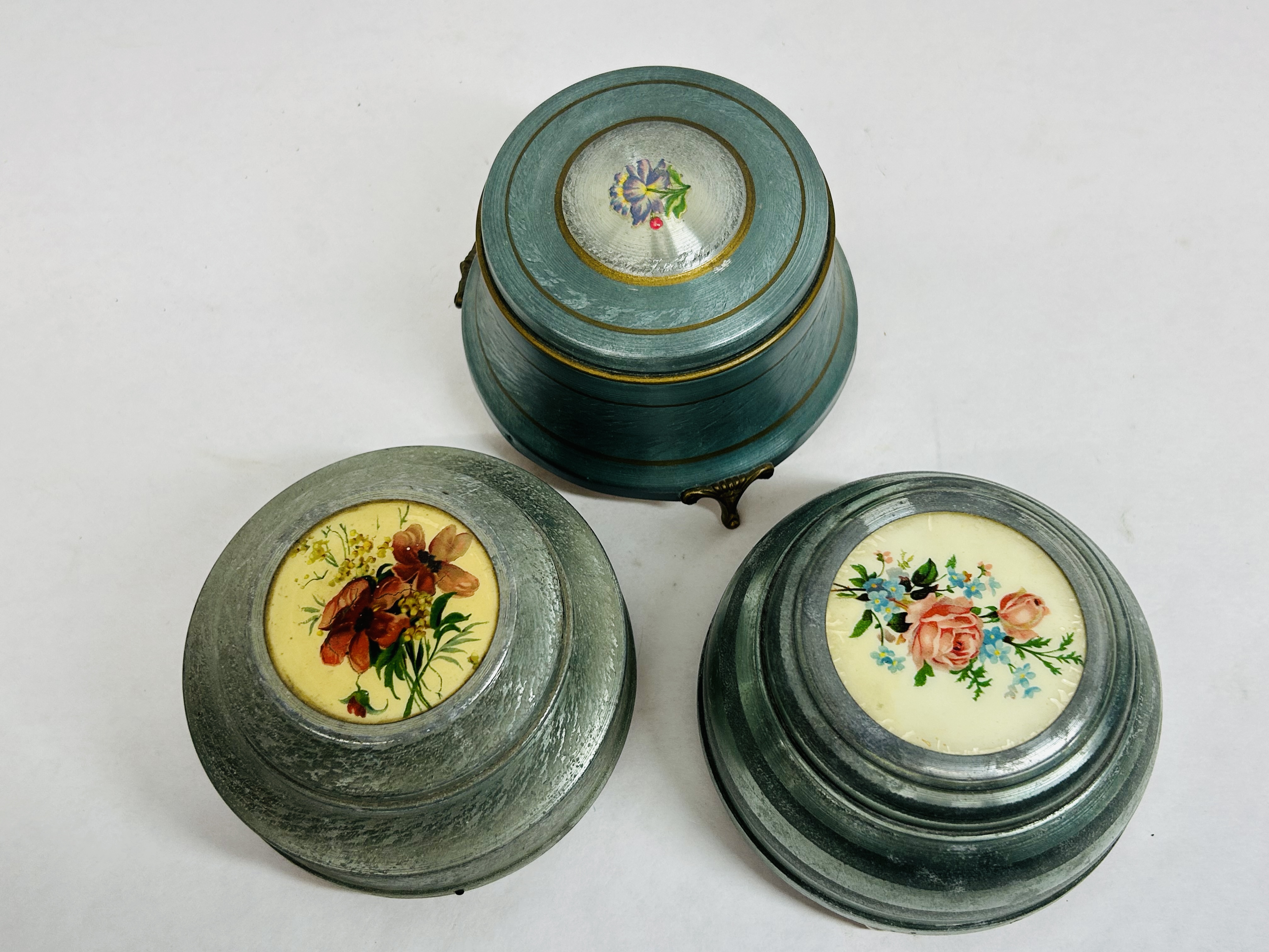 THREE ALUMINUM MUSICAL POWDER BOXES, C. 1940