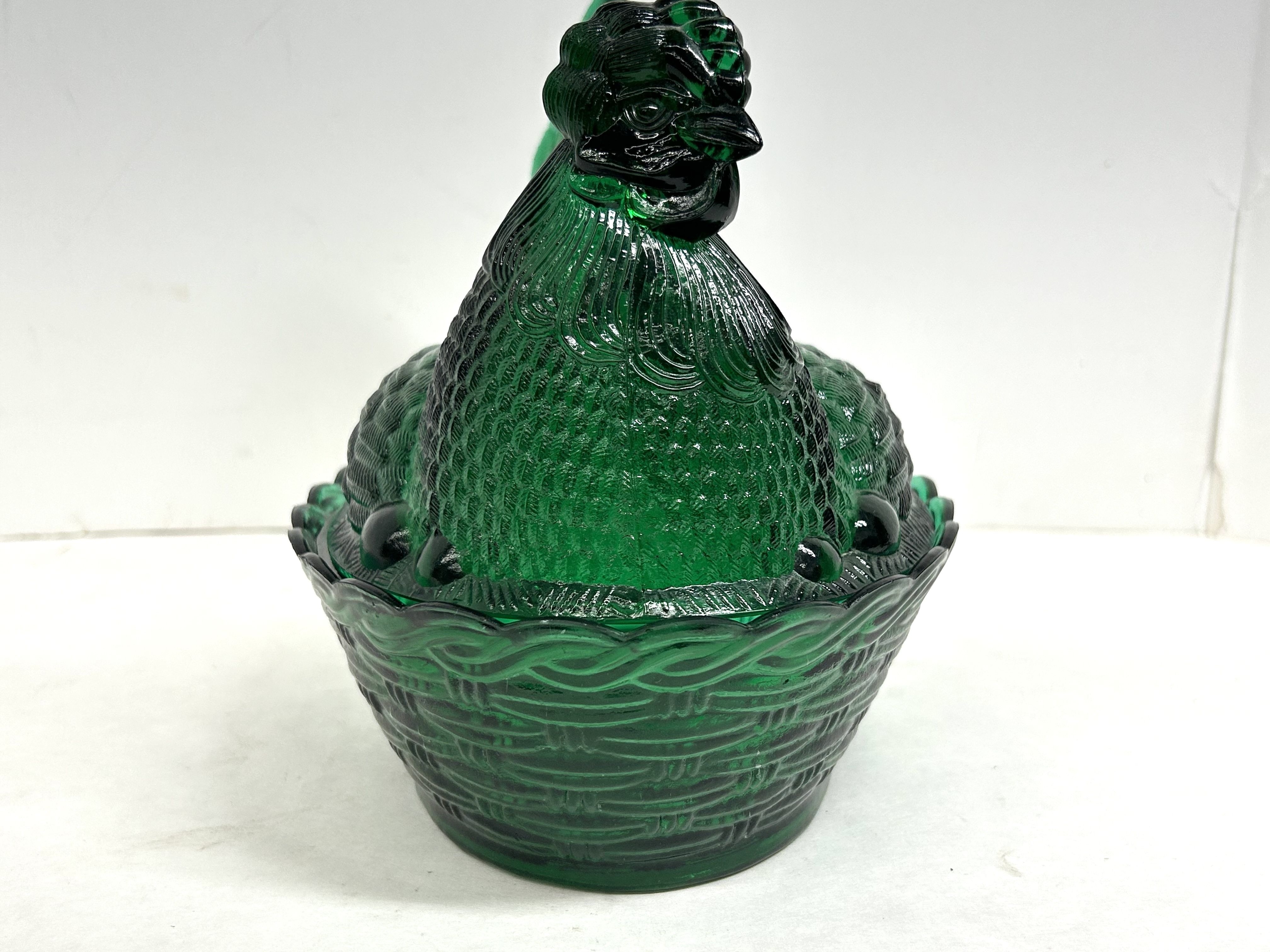 EMERALD GREEN HEN ON NEST