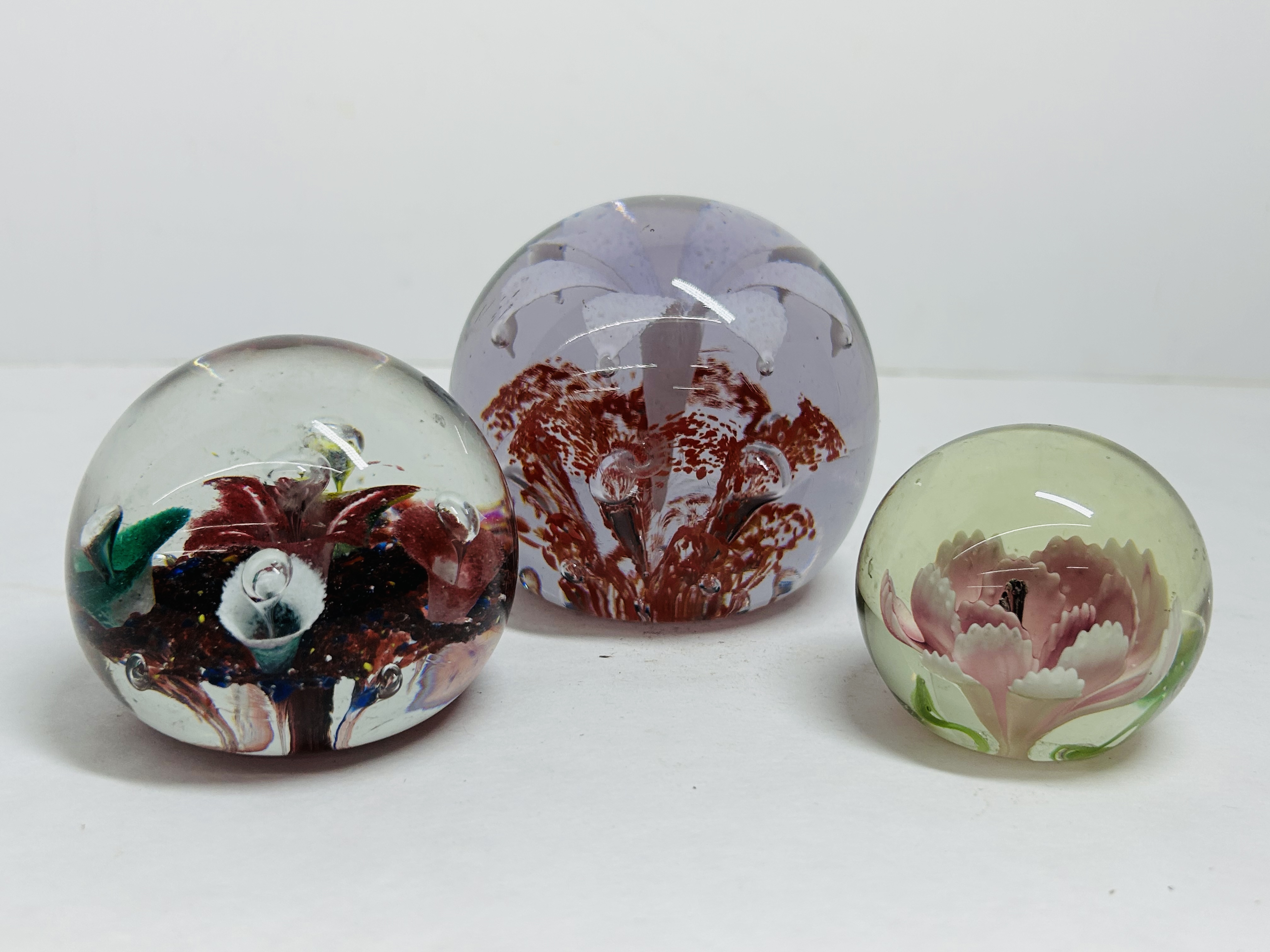 THREE FLORAL GLASS PAPERWEIGHTS, 20TH CENTURY