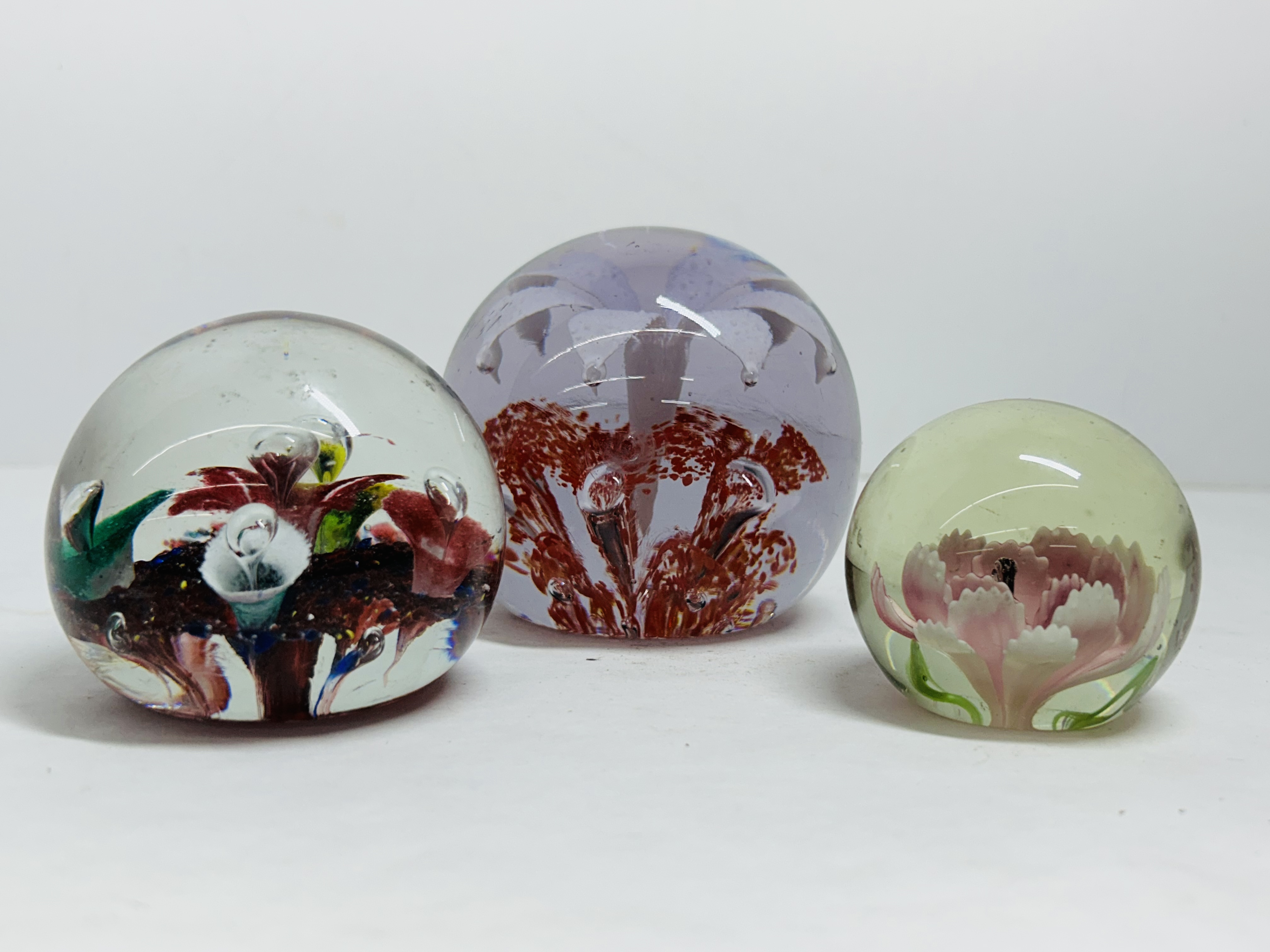 THREE FLORAL GLASS PAPERWEIGHTS, 20TH CENTURY