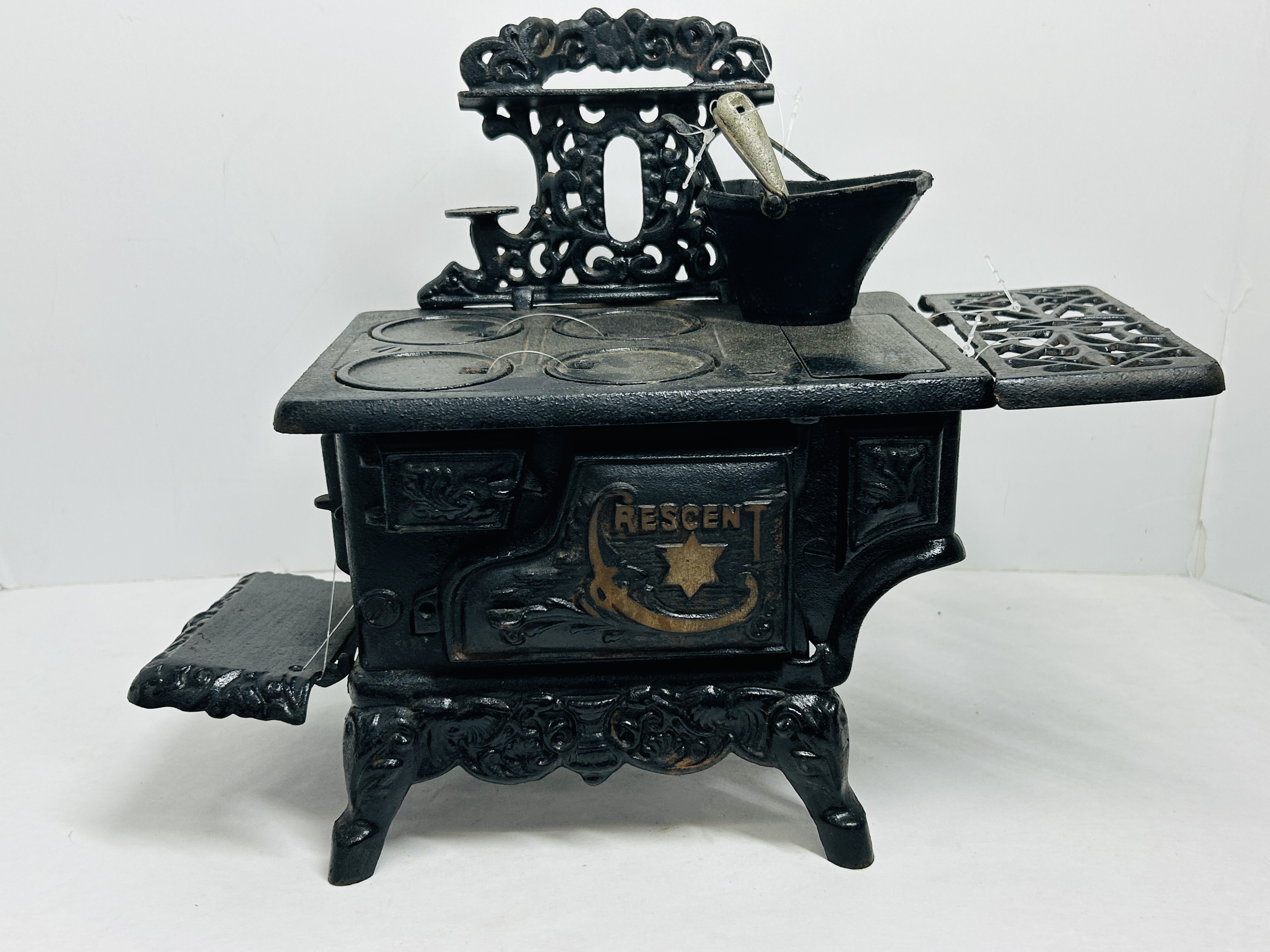 CRESCENT CAST IRON MINIATURE STOVE CIRCA 1900