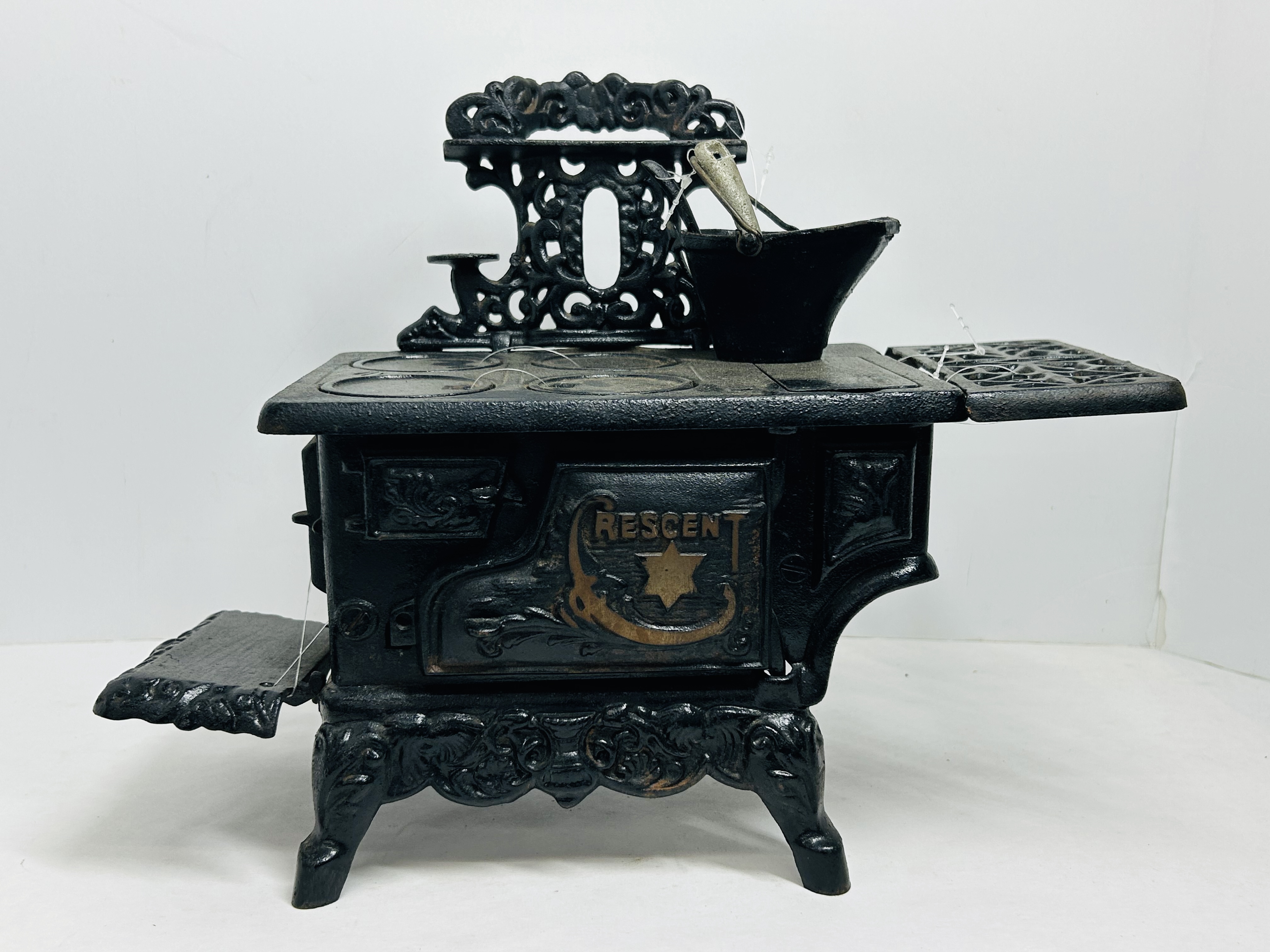 CRESCENT CAST IRON MINIATURE STOVE CIRCA 1900