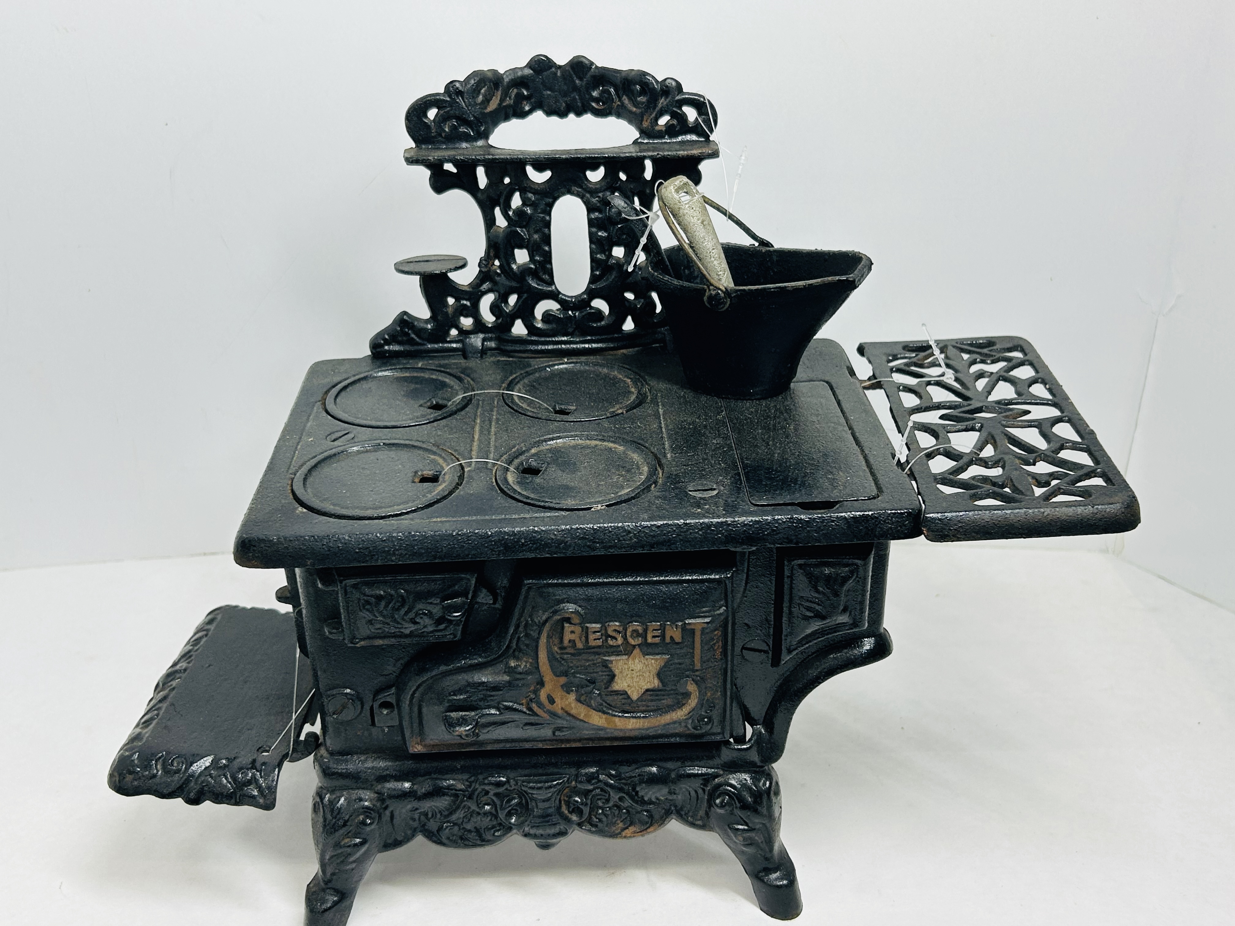 CRESCENT CAST IRON MINIATURE STOVE CIRCA 1900