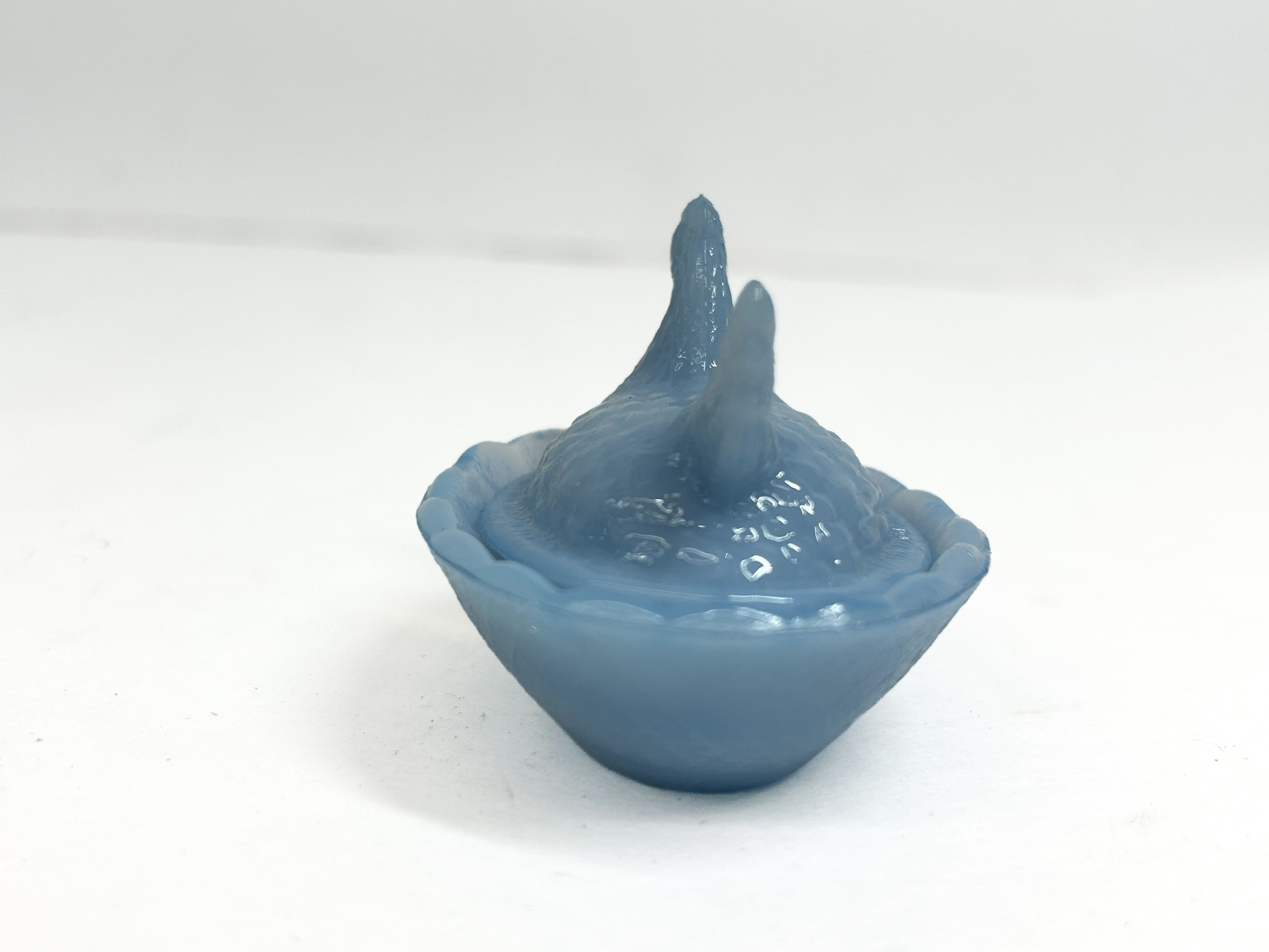 BLUE GLASS HEN ON NEST