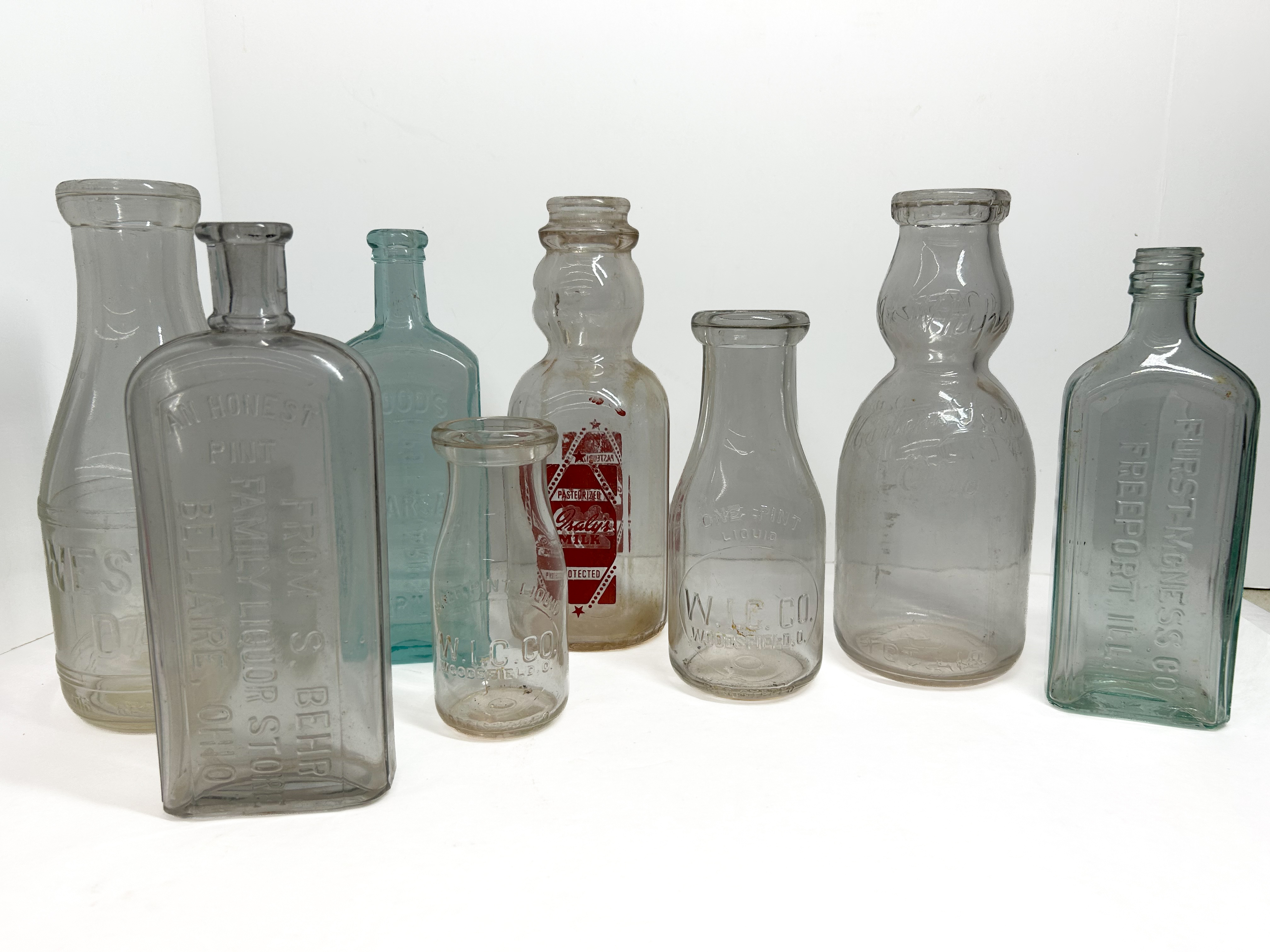 VARIOUS MAKERS, GLASS ADVERTISING BOTTLES, 1900-1950