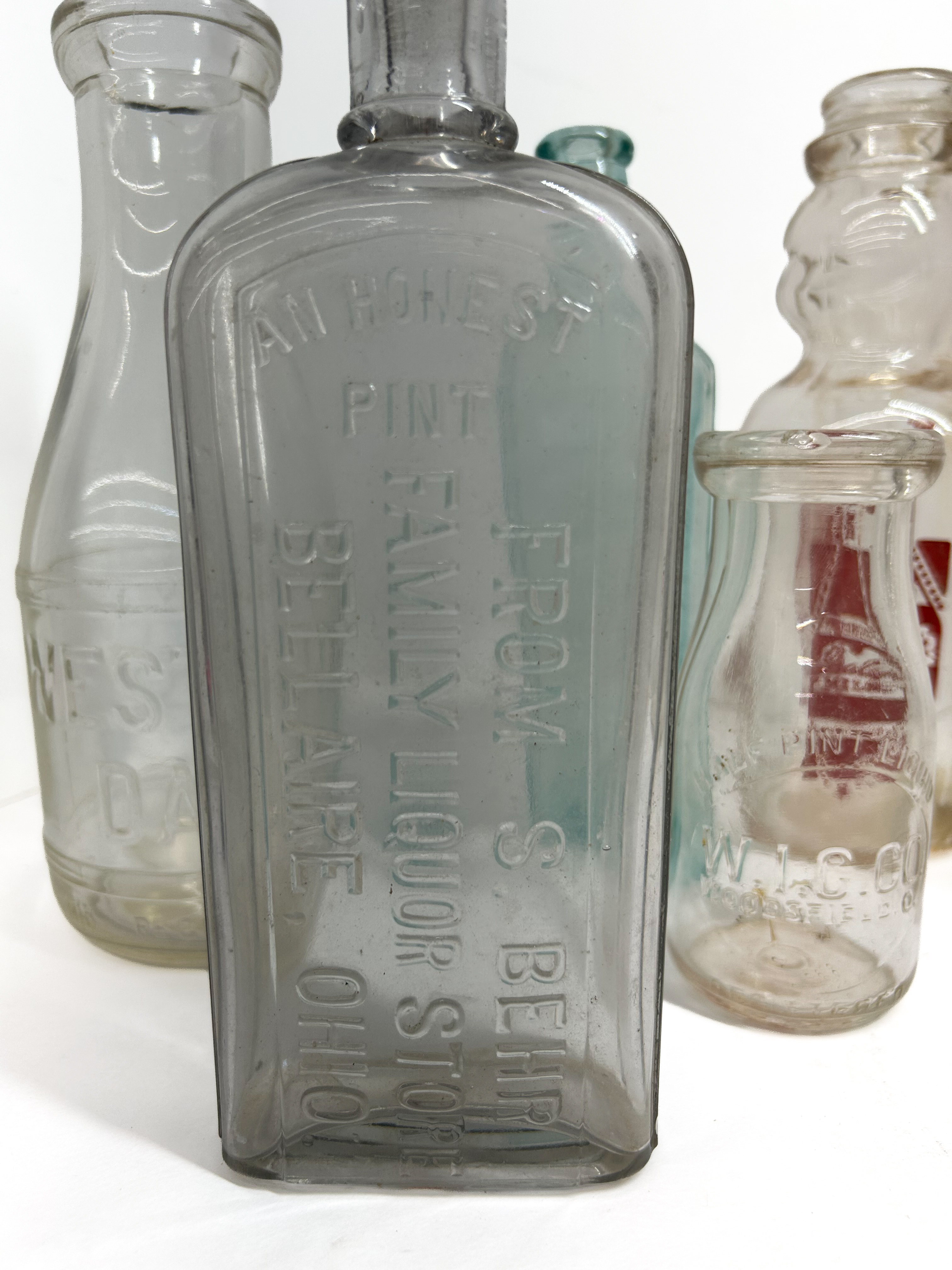 VARIOUS MAKERS, GLASS ADVERTISING BOTTLES, 1900-1950