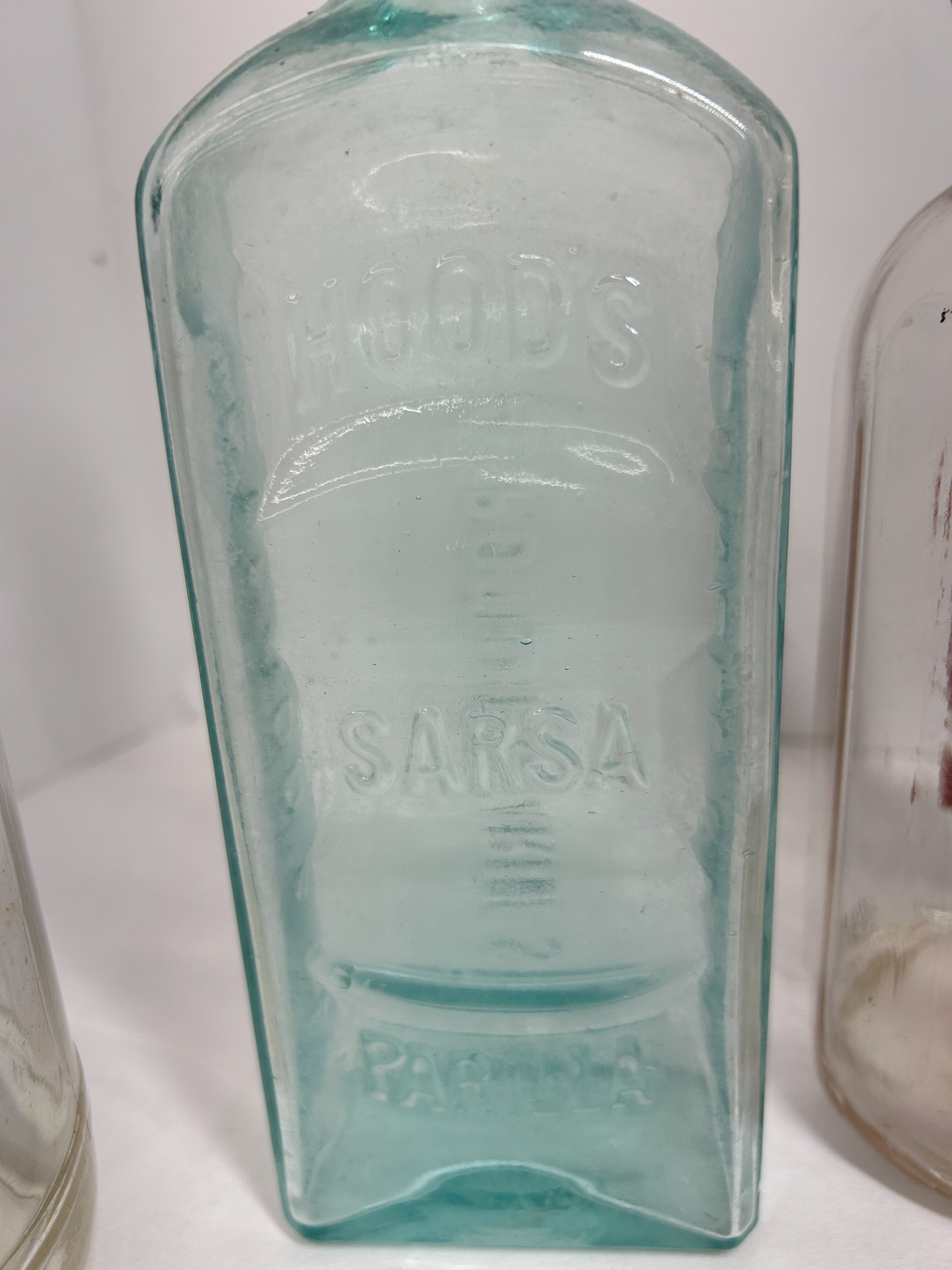 VARIOUS MAKERS, GLASS ADVERTISING BOTTLES, 1900-1950