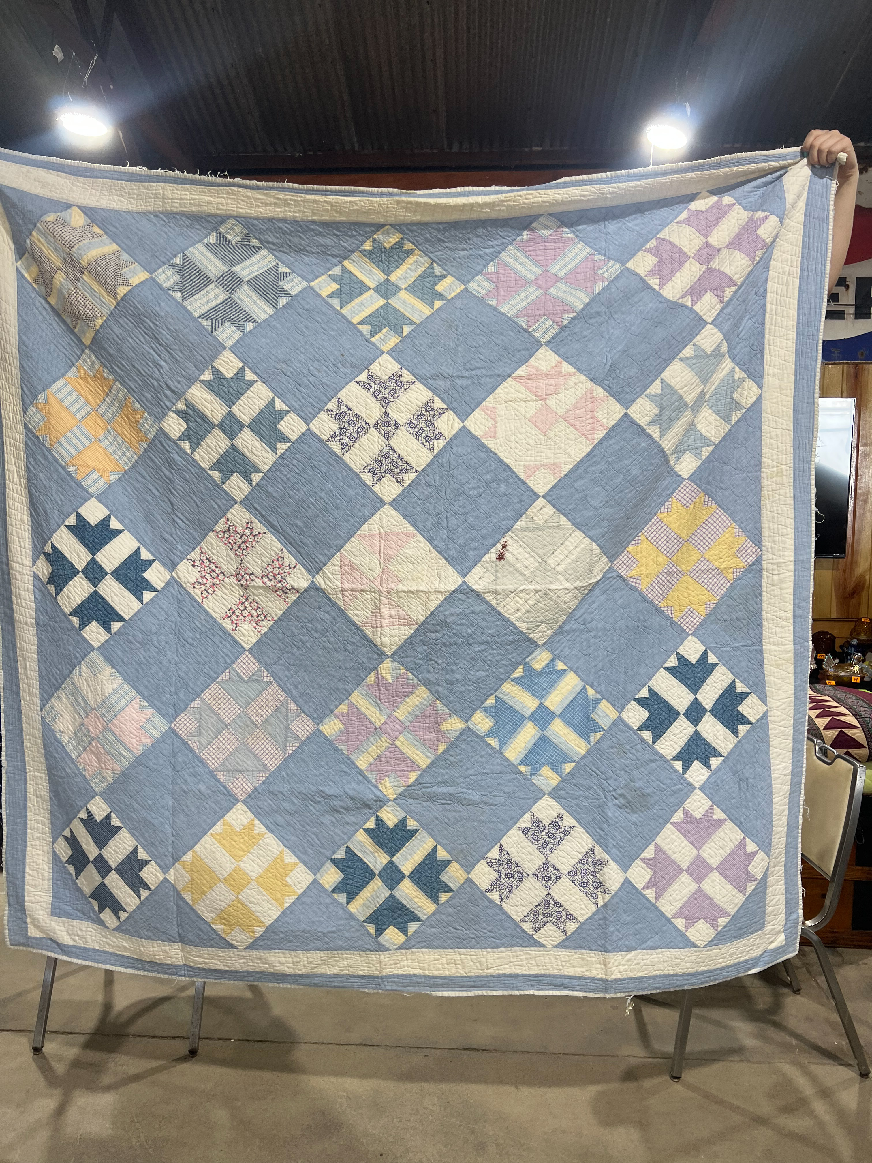 Two Vintage Hand-Stitched Cotton Quilts Including Bear Paw and Spool Patterns