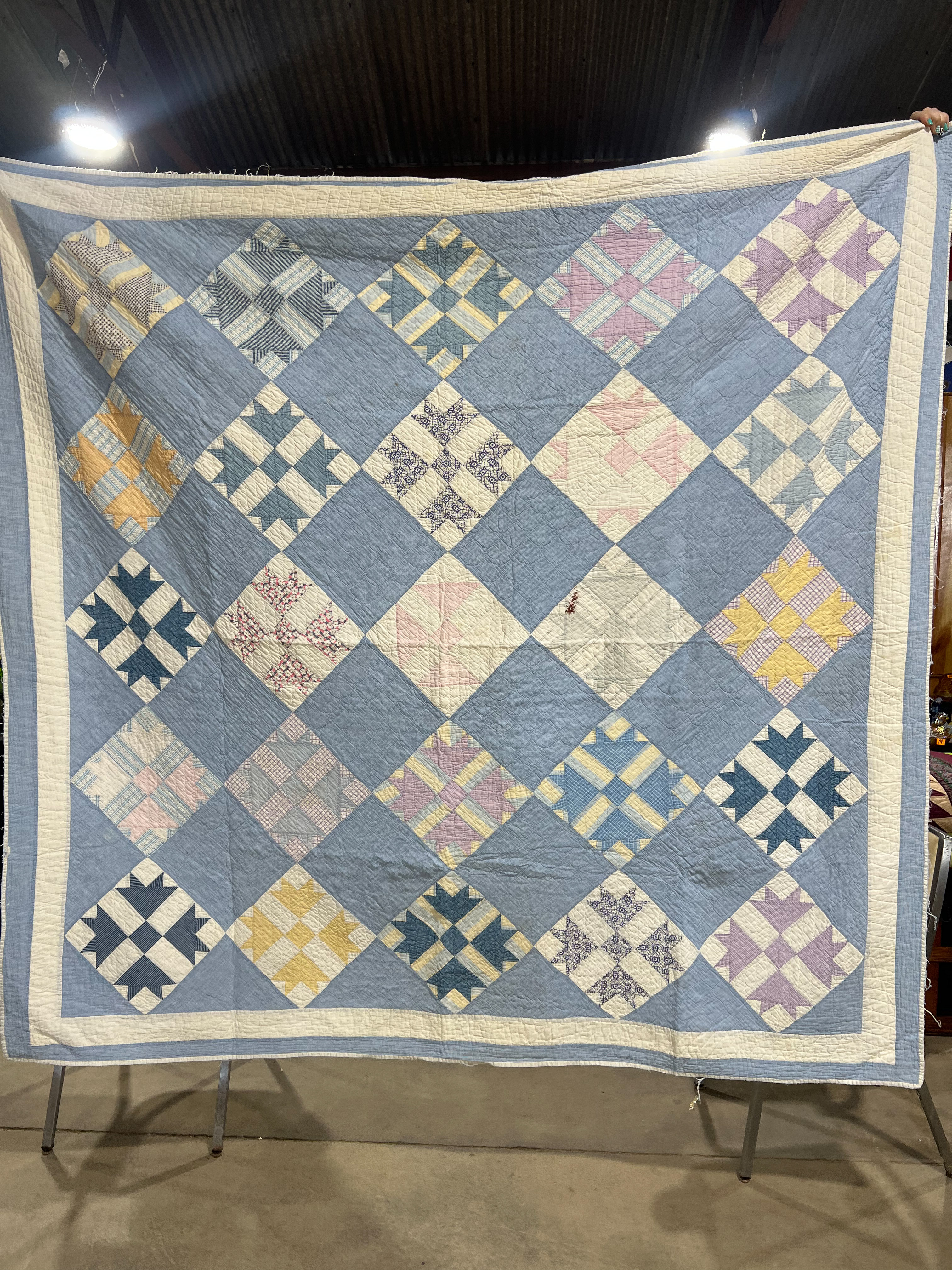 Two Vintage Hand-Stitched Cotton Quilts Including Bear Paw and Spool Patterns