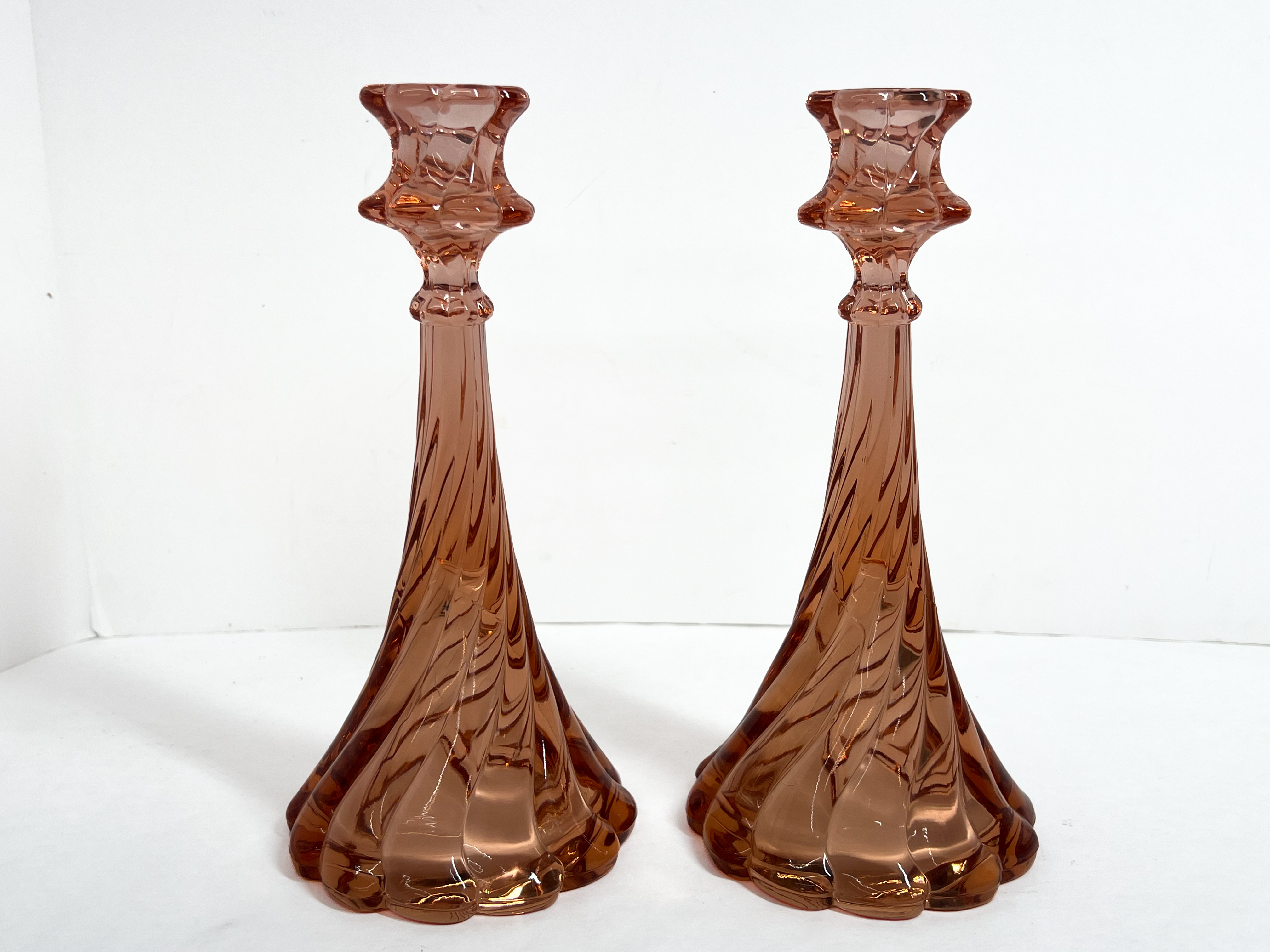 A Pair of Fostoria Virginia Pink Candlesticks and a Set of Fenton Silver Crest Milk Glass Candlesticks