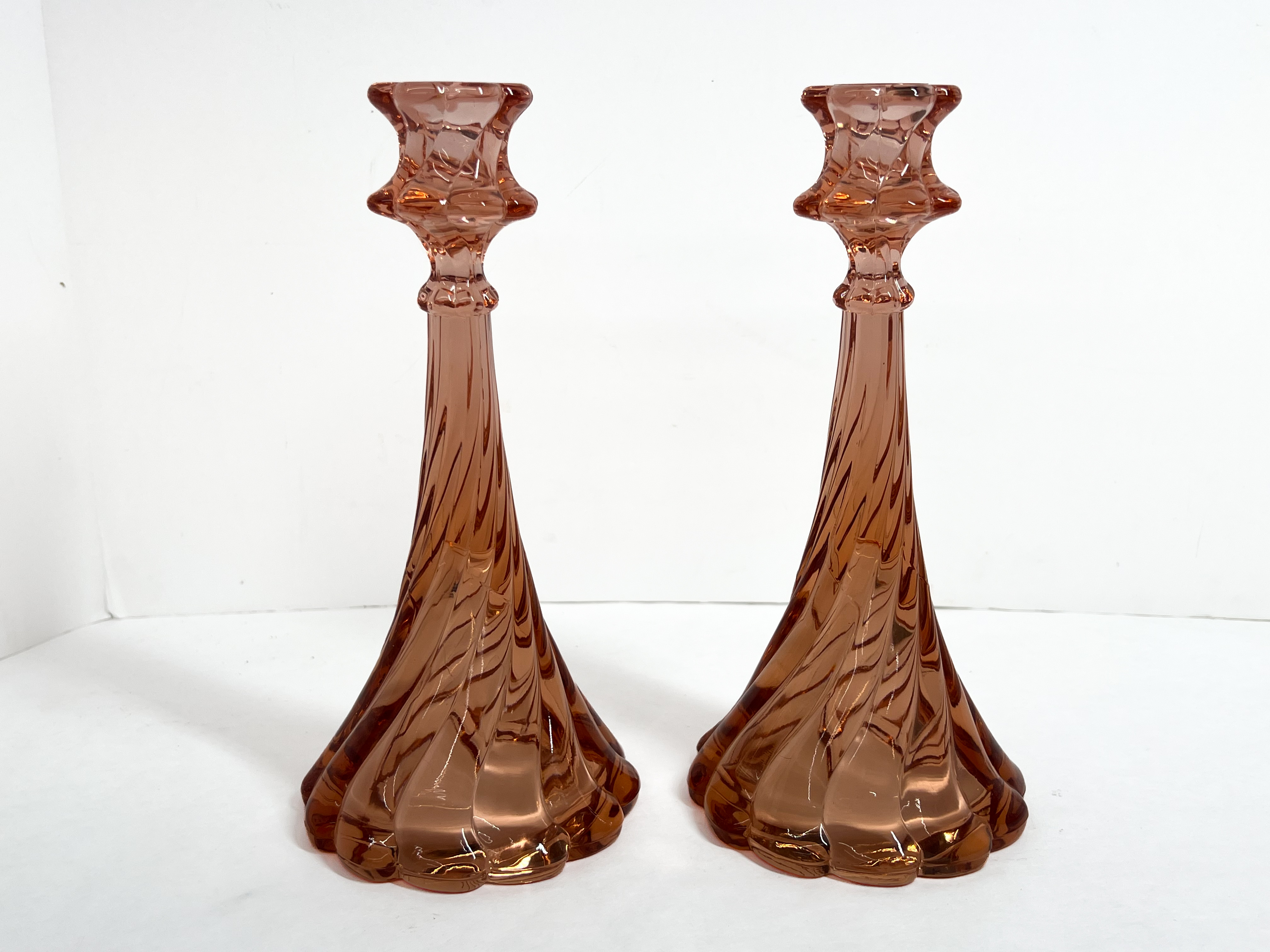 A Pair of Fostoria Virginia Pink Candlesticks and a Set of Fenton Silver Crest Milk Glass Candlesticks