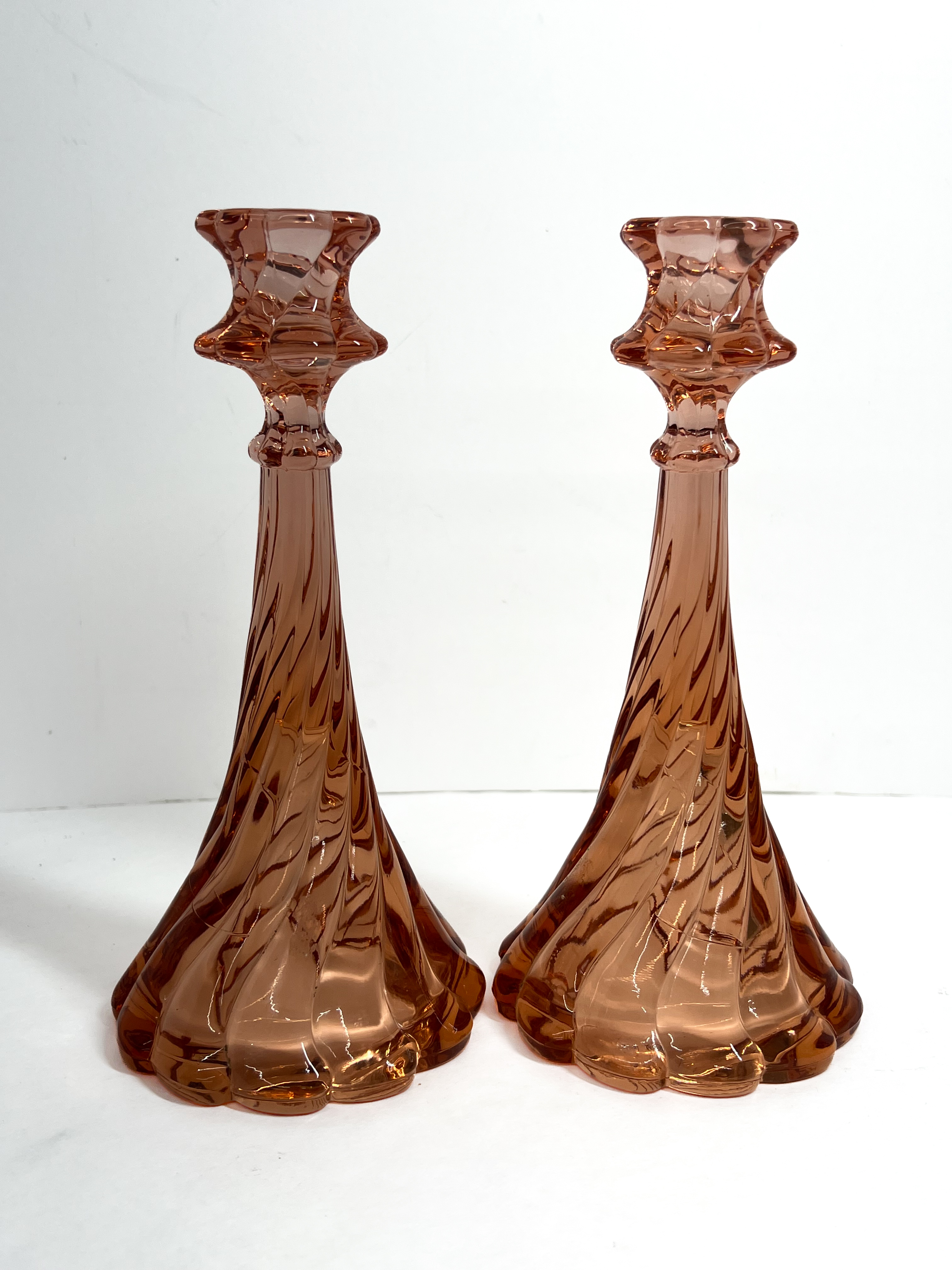 A Pair of Fostoria Virginia Pink Candlesticks and a Set of Fenton Silver Crest Milk Glass Candlesticks