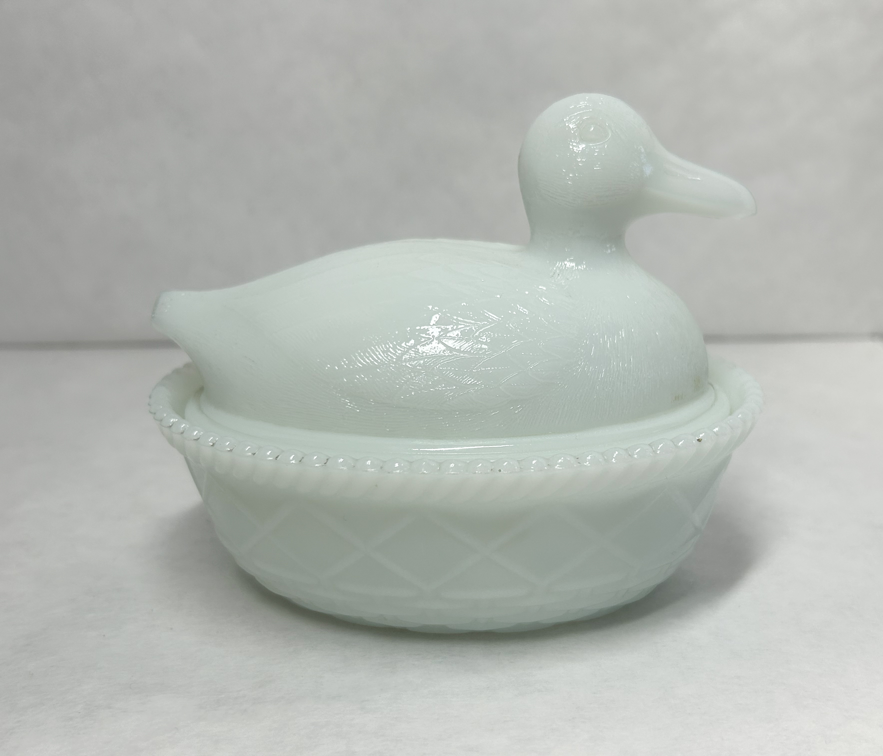 AMERICAN MILK GLASS DUCK, 20TH CENTURY