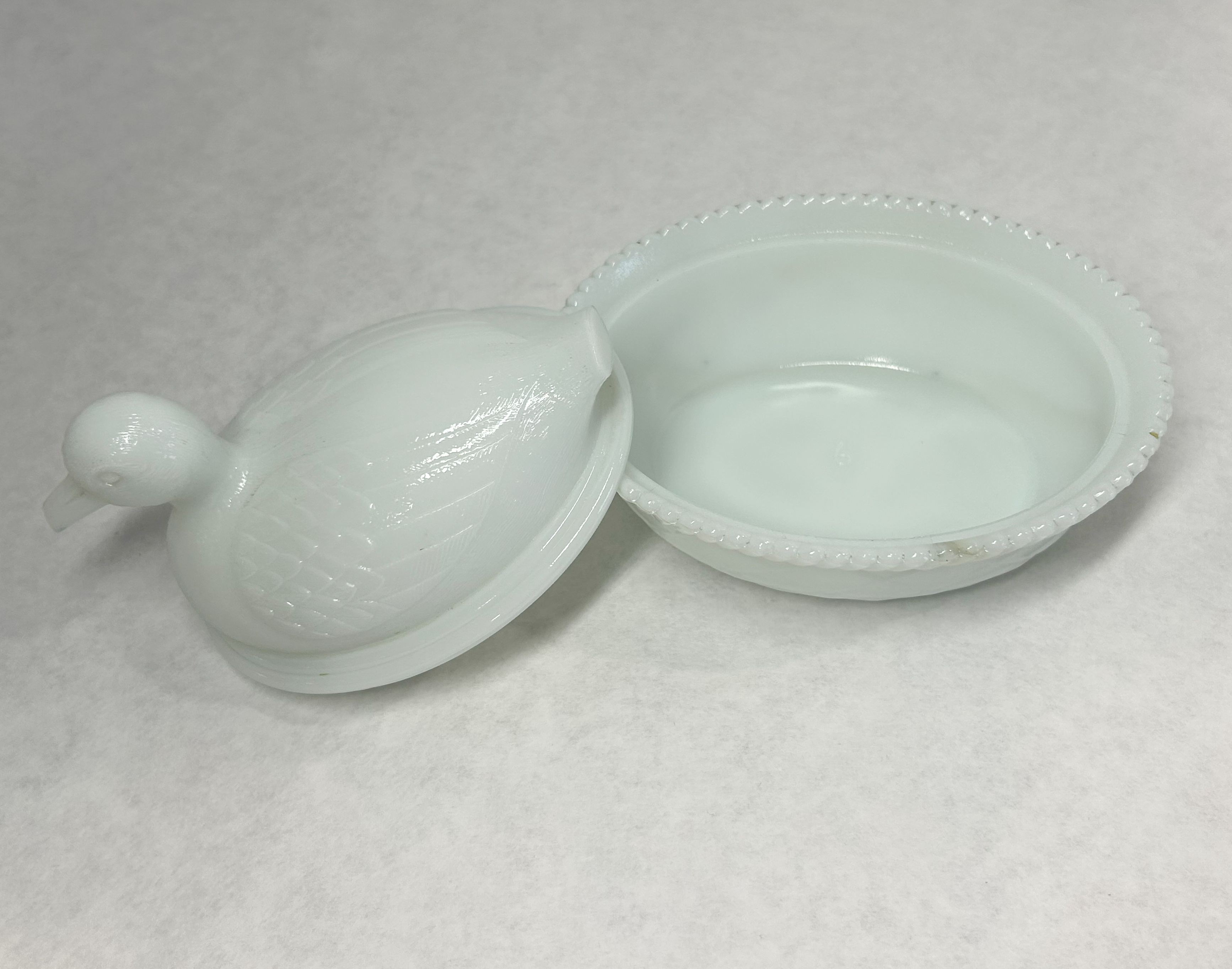 AMERICAN MILK GLASS DUCK, 20TH CENTURY