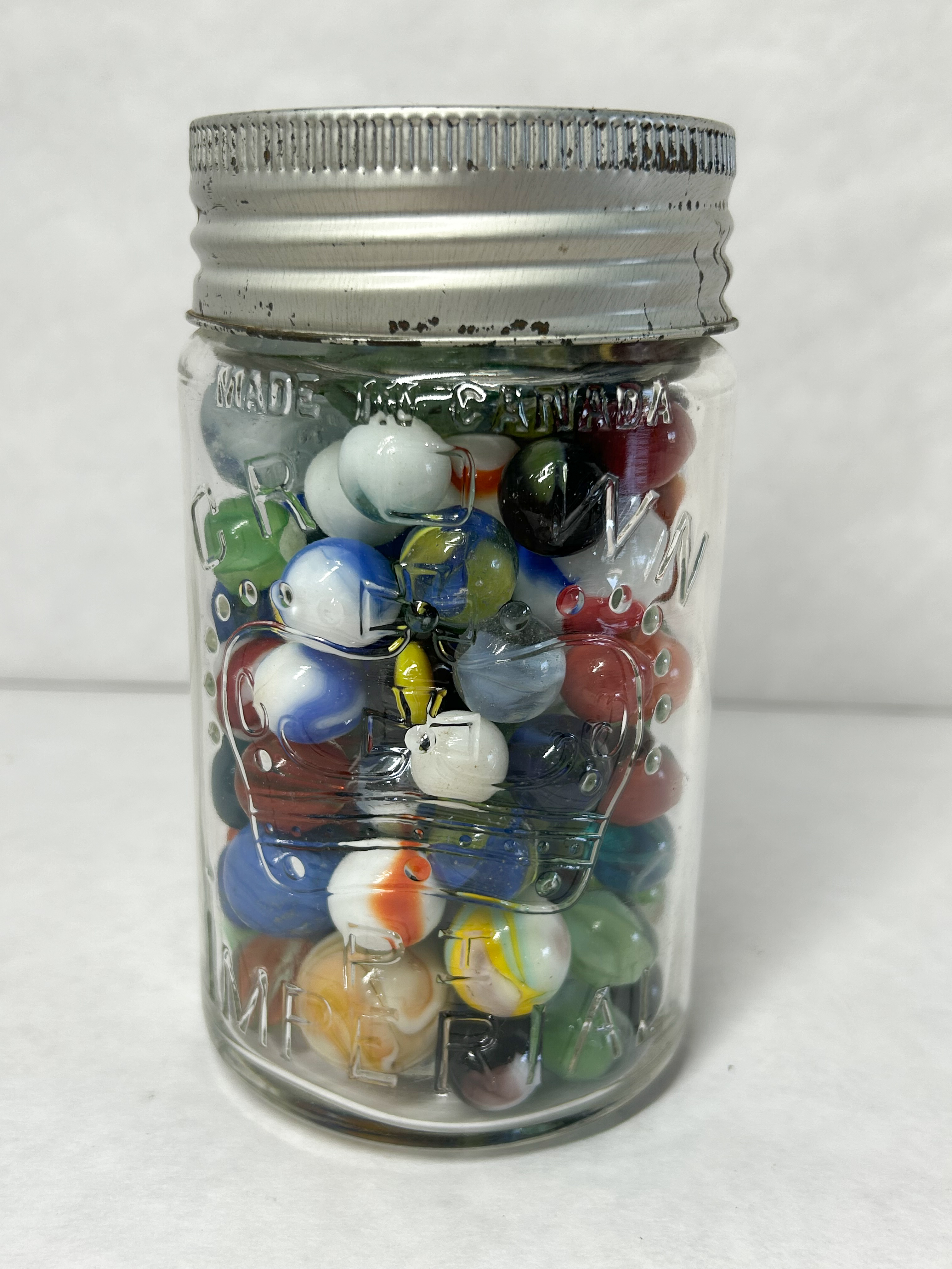 CROWN GLASS JAR AND MARBLES