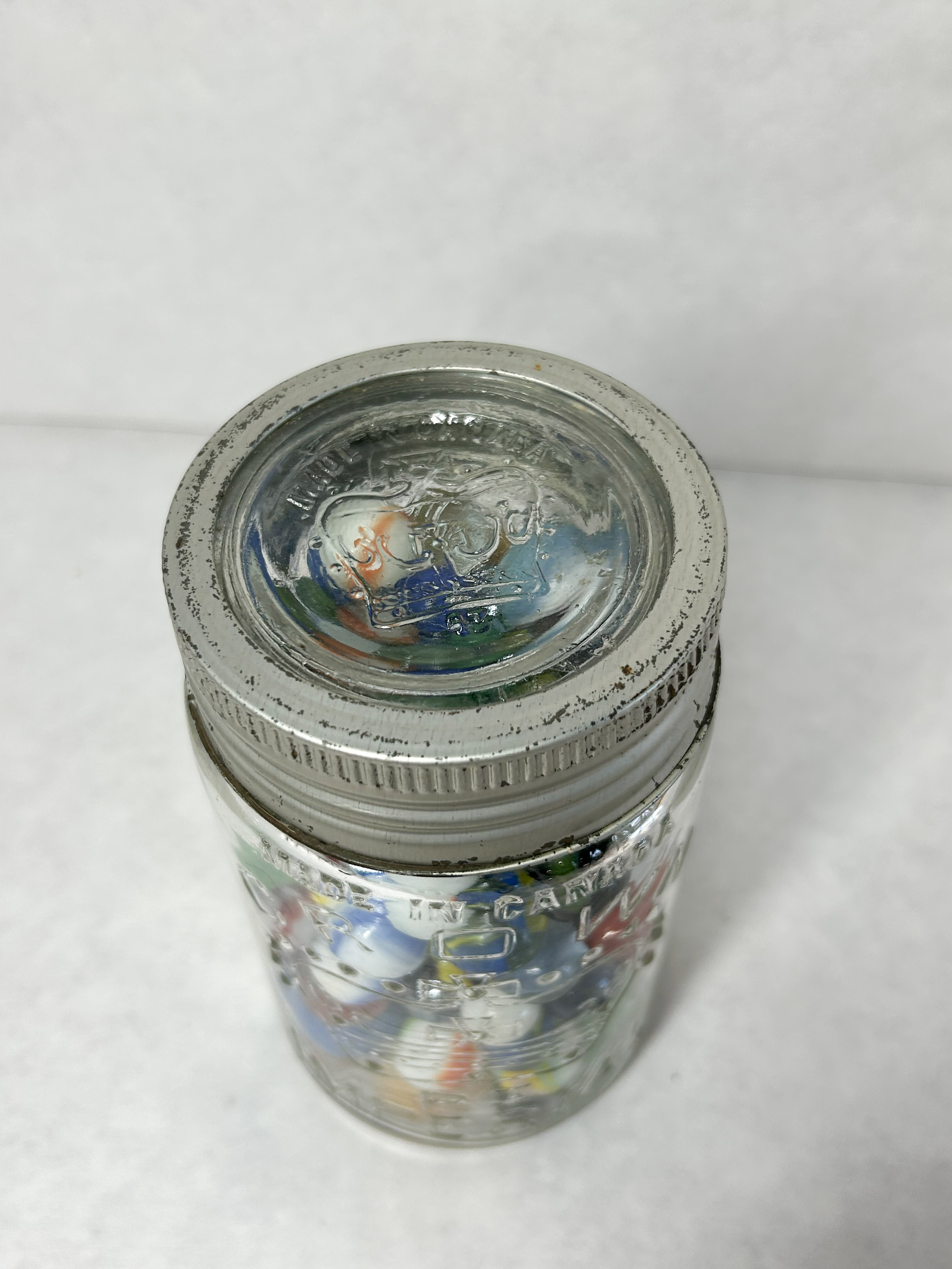 CROWN GLASS JAR AND MARBLES