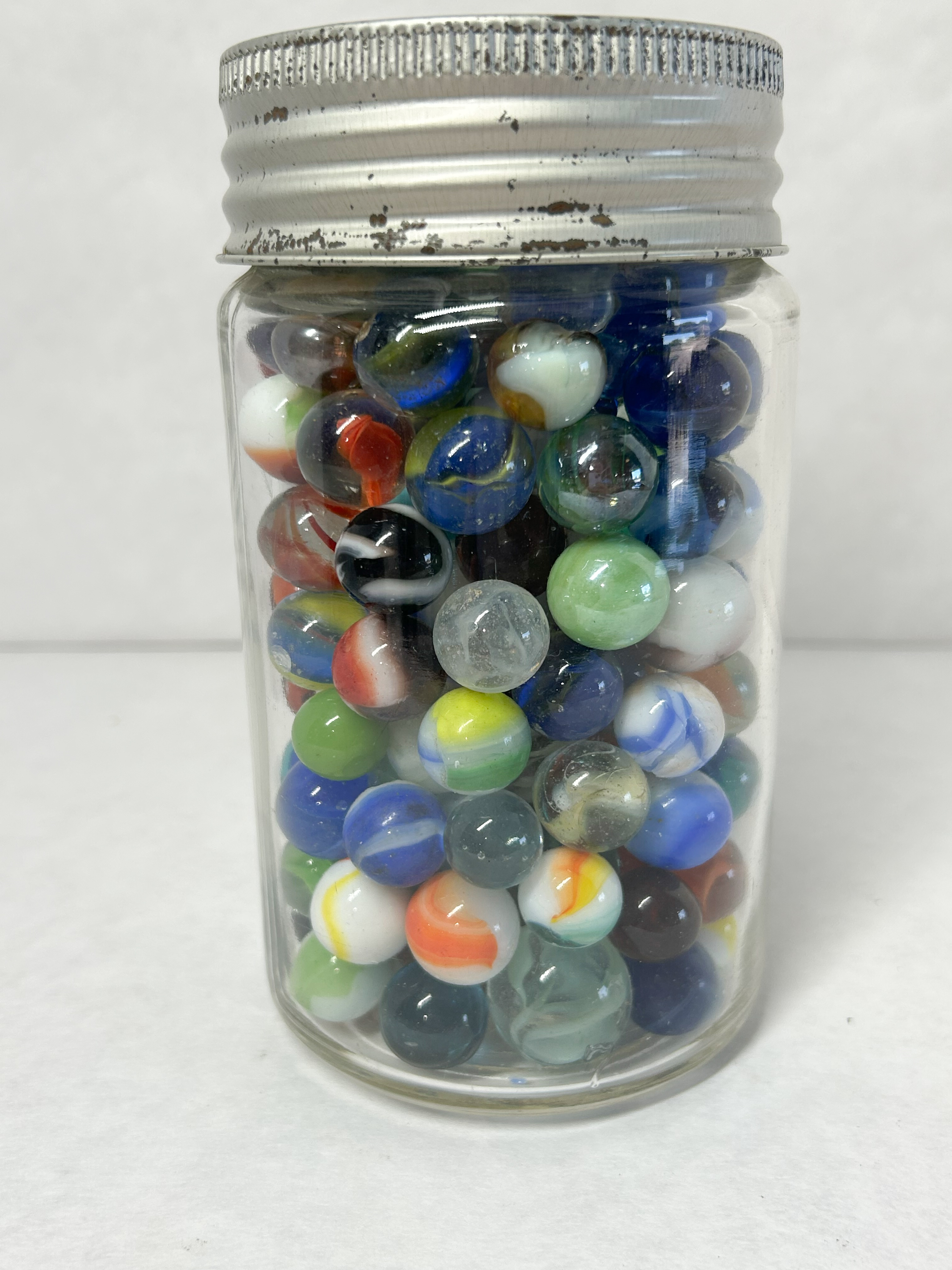 CROWN GLASS JAR AND MARBLES
