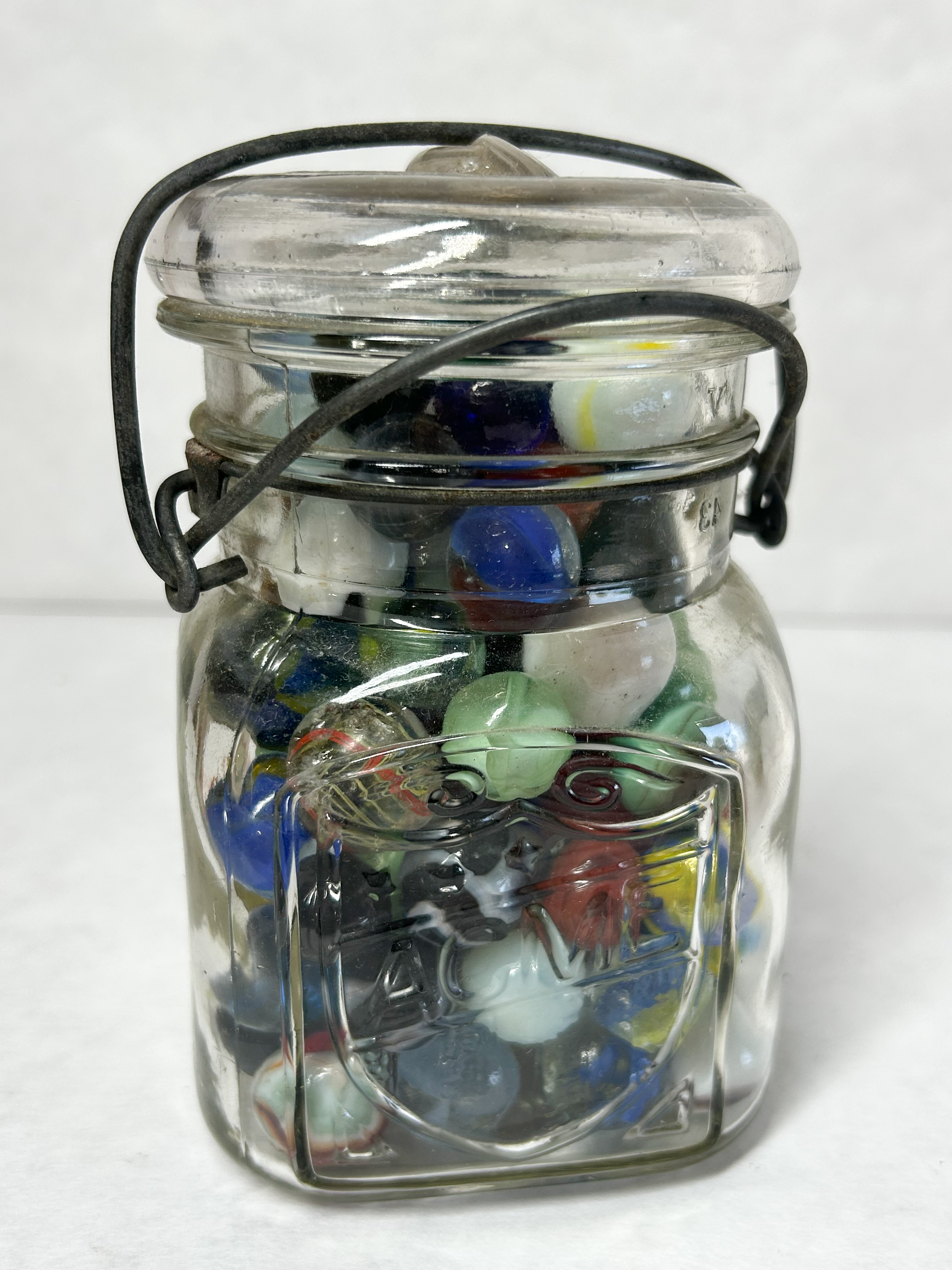 ACME VINTAGE MARBLES IN JAR