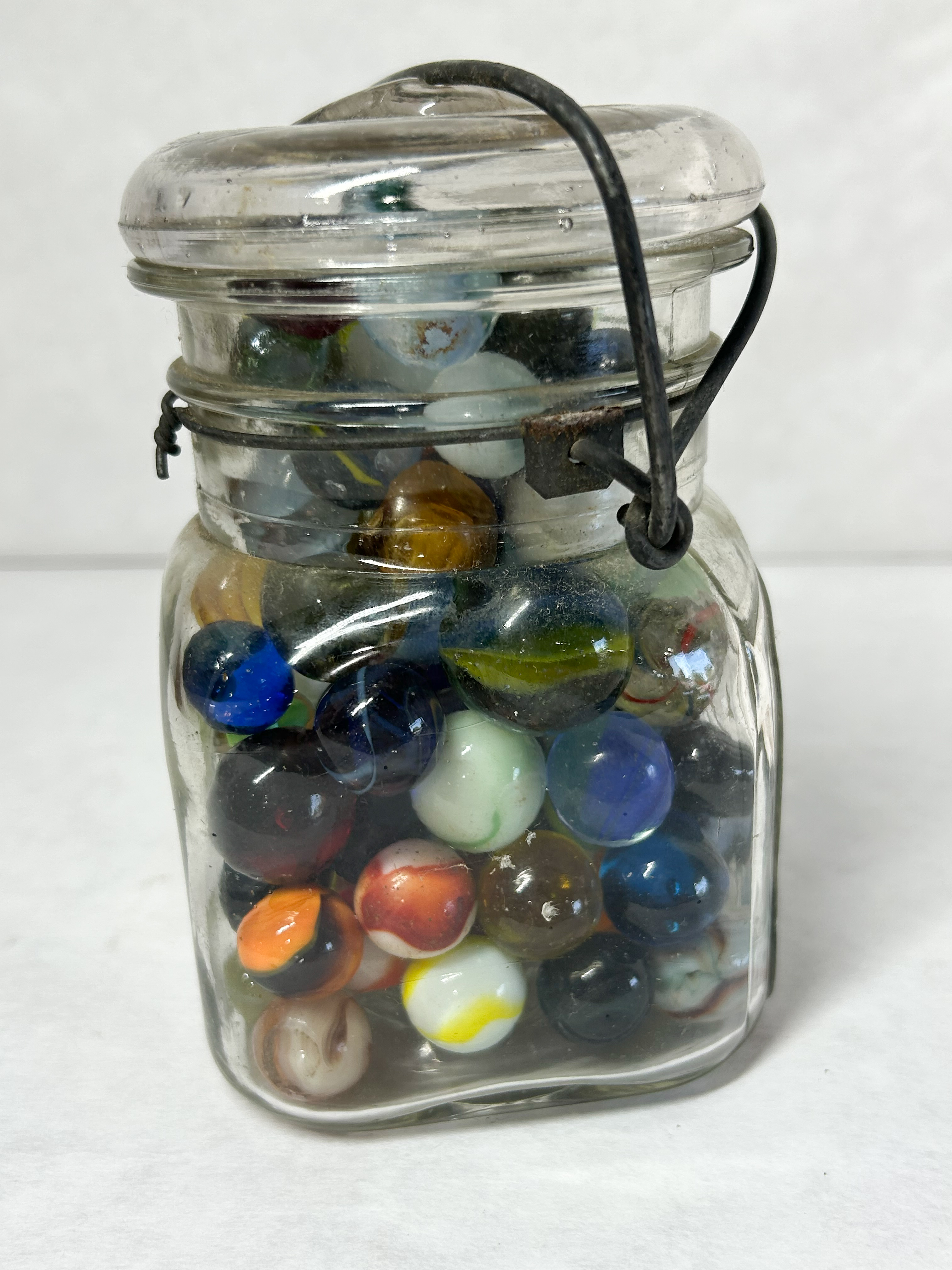 ACME VINTAGE MARBLES IN JAR