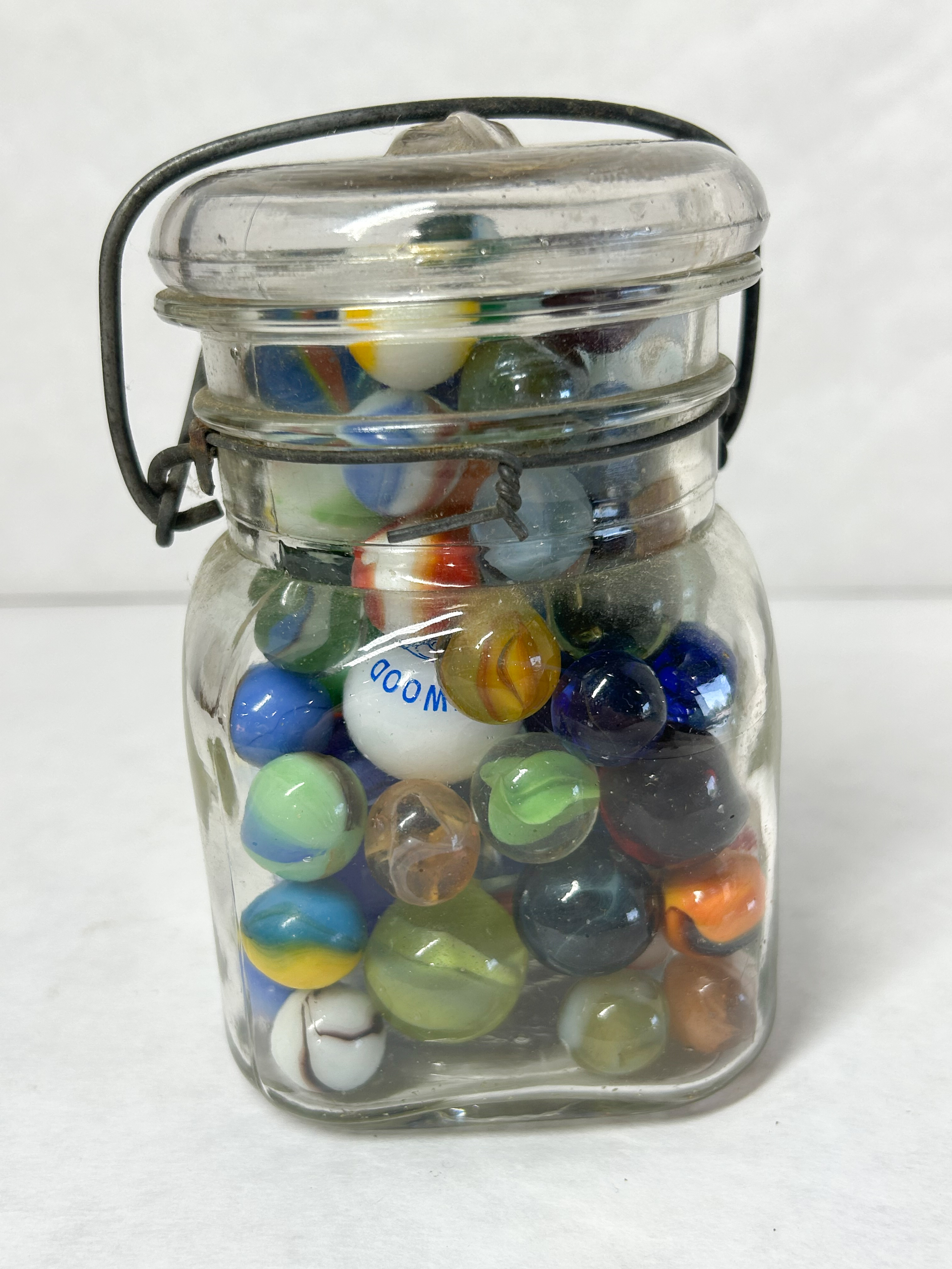 ACME VINTAGE MARBLES IN JAR