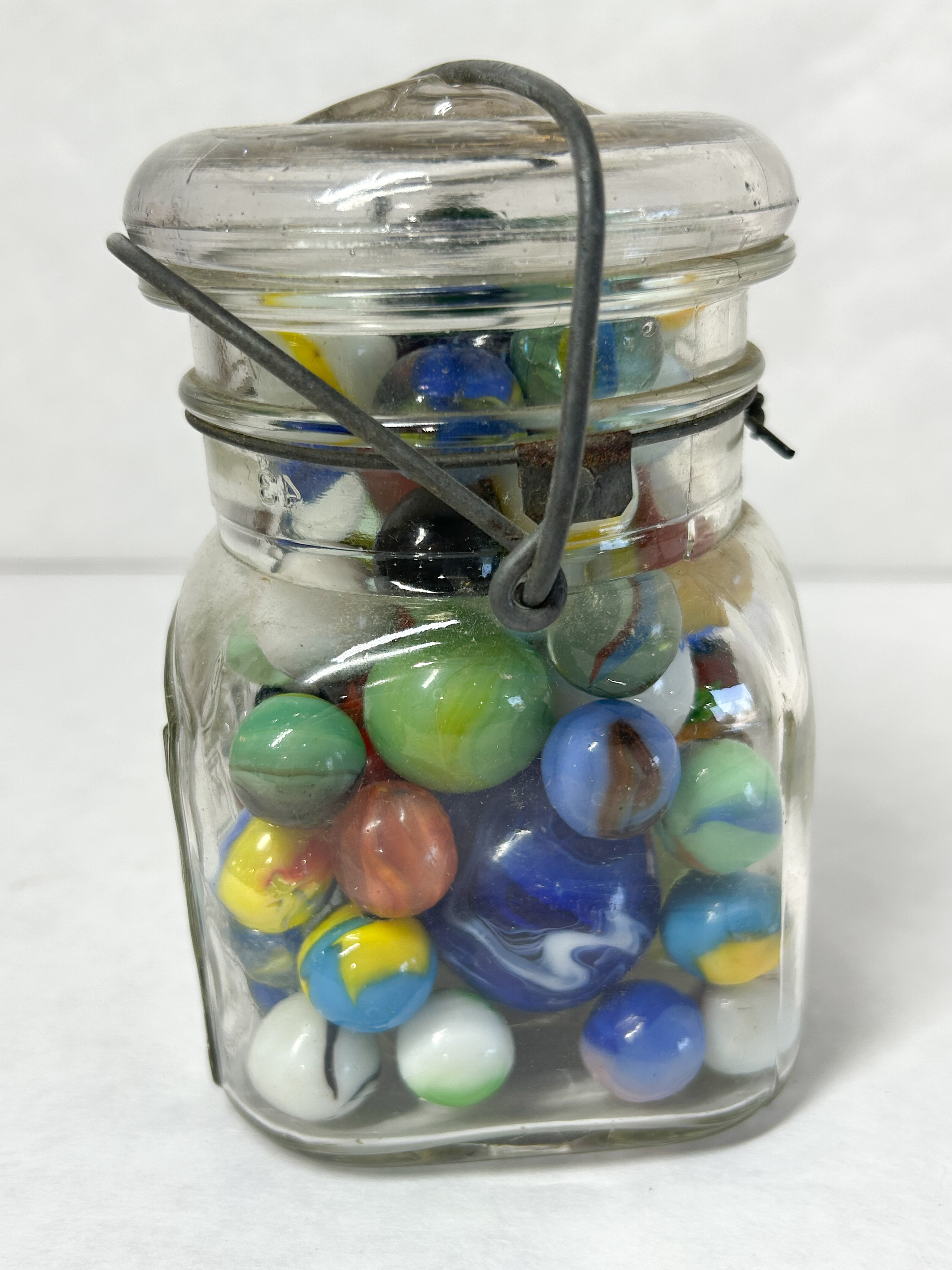 ACME VINTAGE MARBLES IN JAR