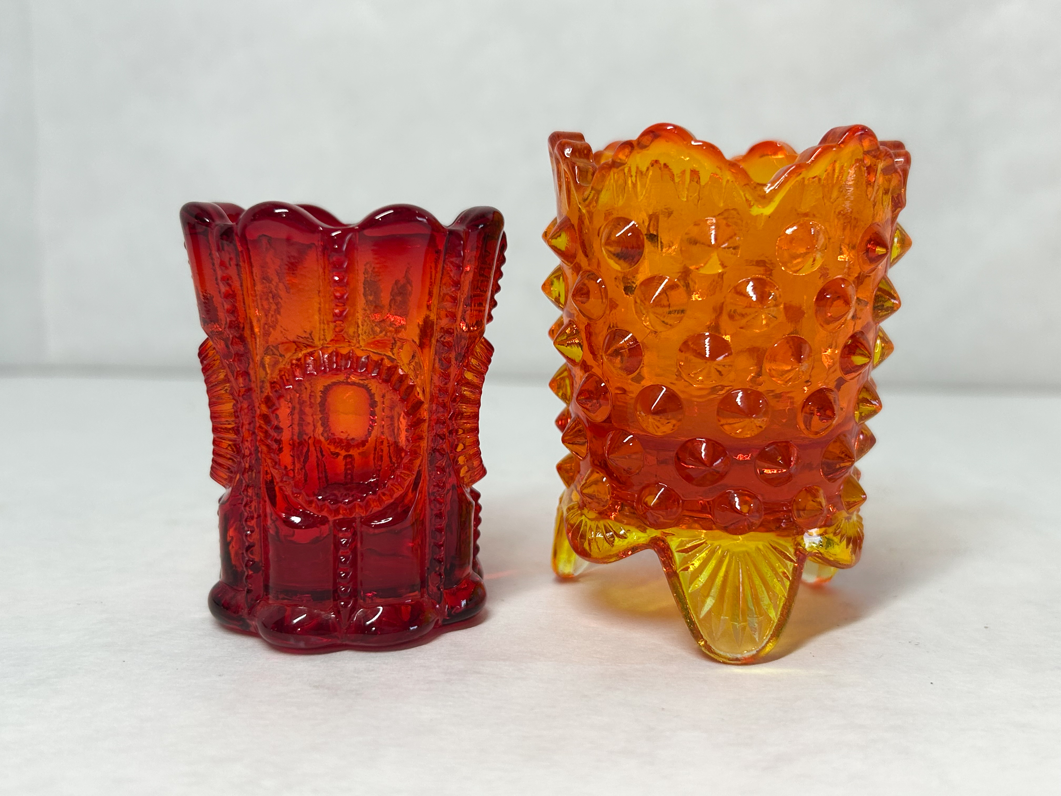 TWO AMBERINA GLASS TOOTHPICK HOLDERS, MID-20TH CENTURY