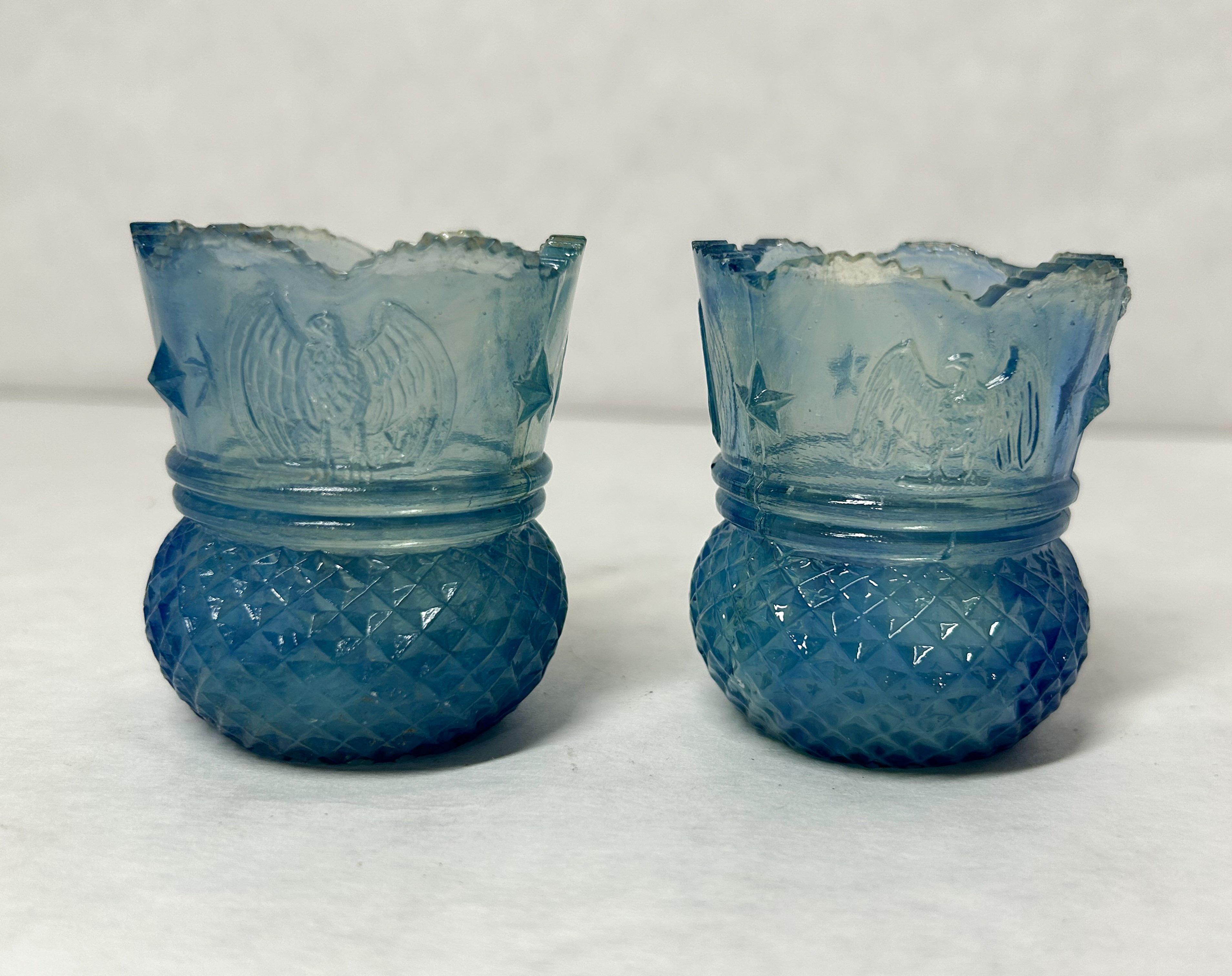 PAIR EAGLE STAR URANIUM GLASS HOLDERS