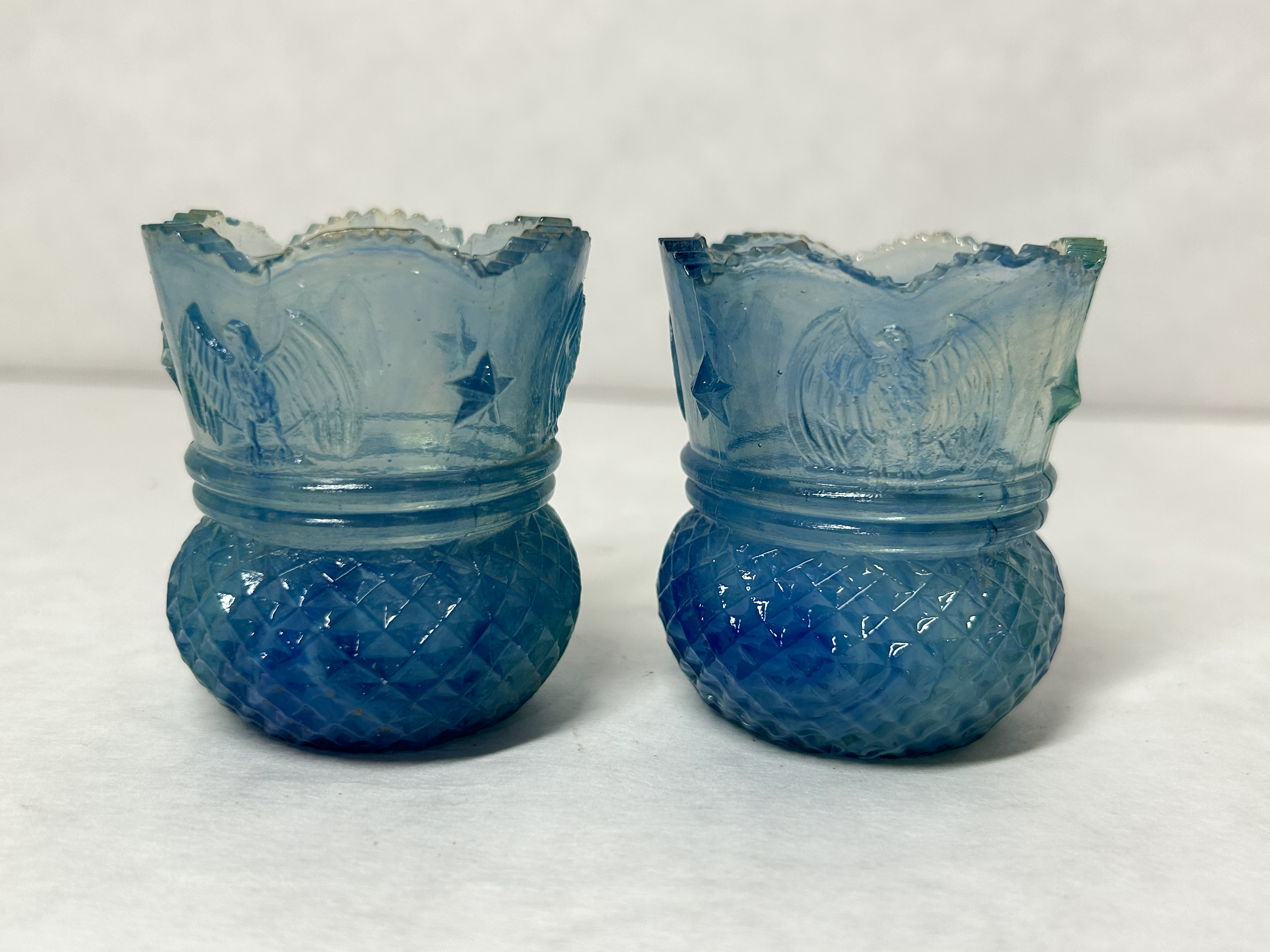 PAIR EAGLE STAR URANIUM GLASS HOLDERS
