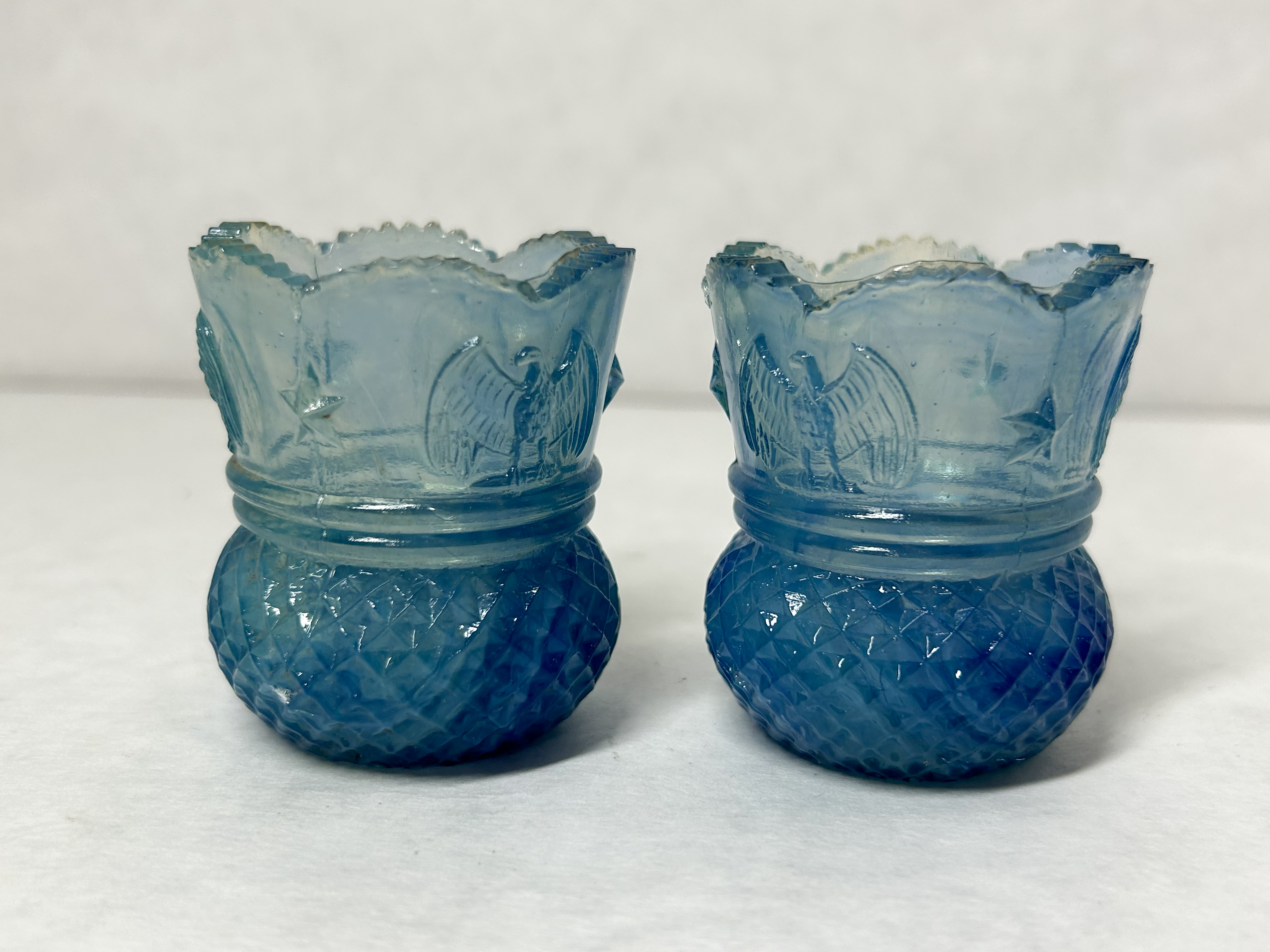 PAIR EAGLE STAR URANIUM GLASS HOLDERS