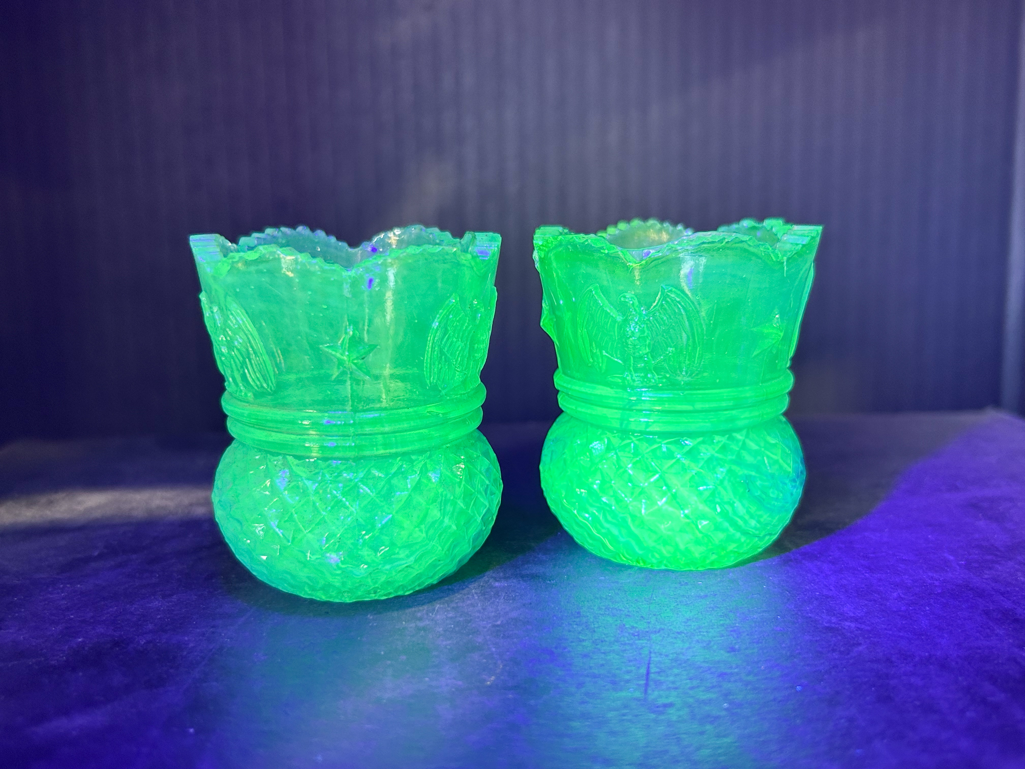 PAIR EAGLE STAR URANIUM GLASS HOLDERS