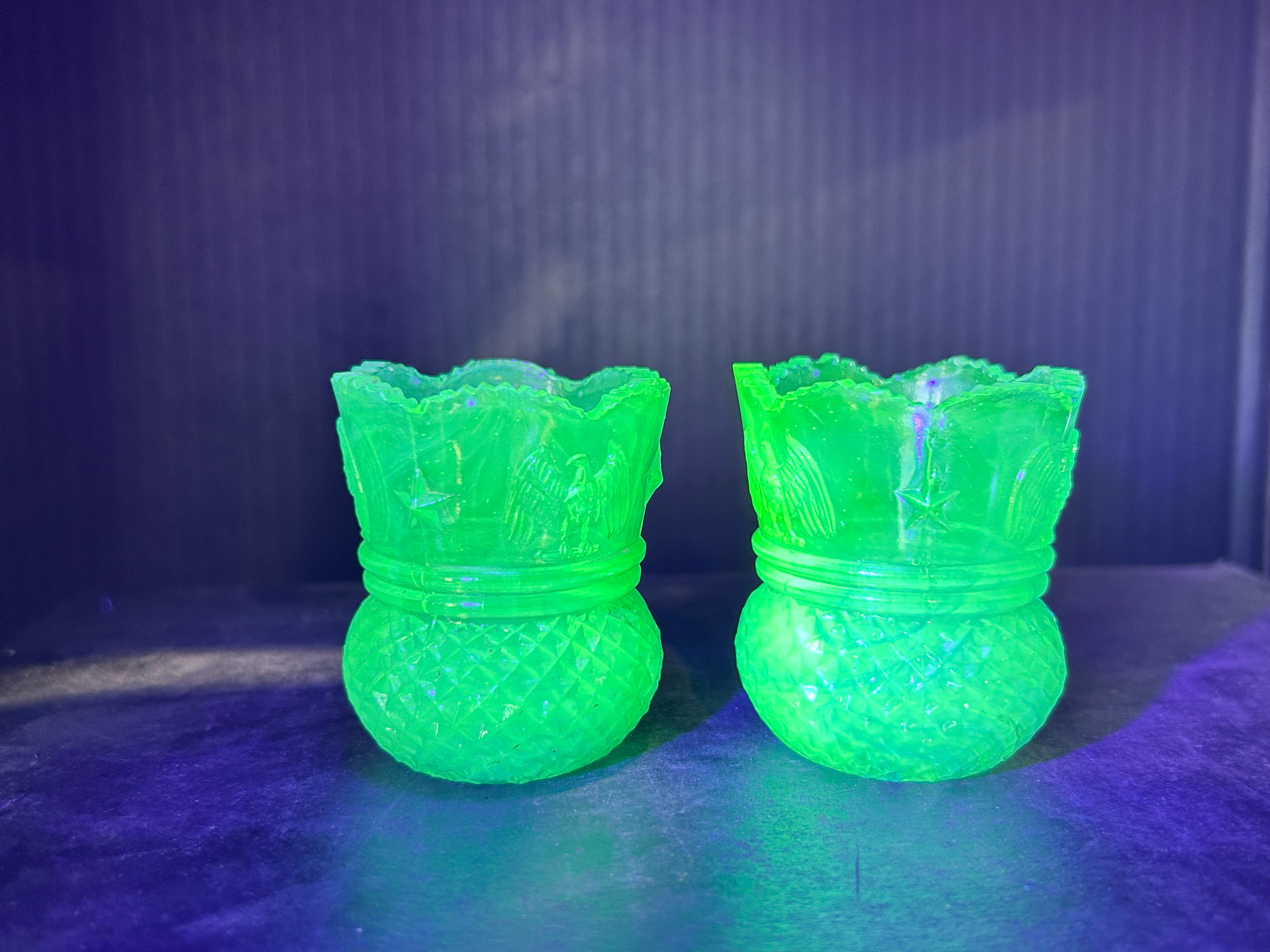 PAIR EAGLE STAR URANIUM GLASS HOLDERS