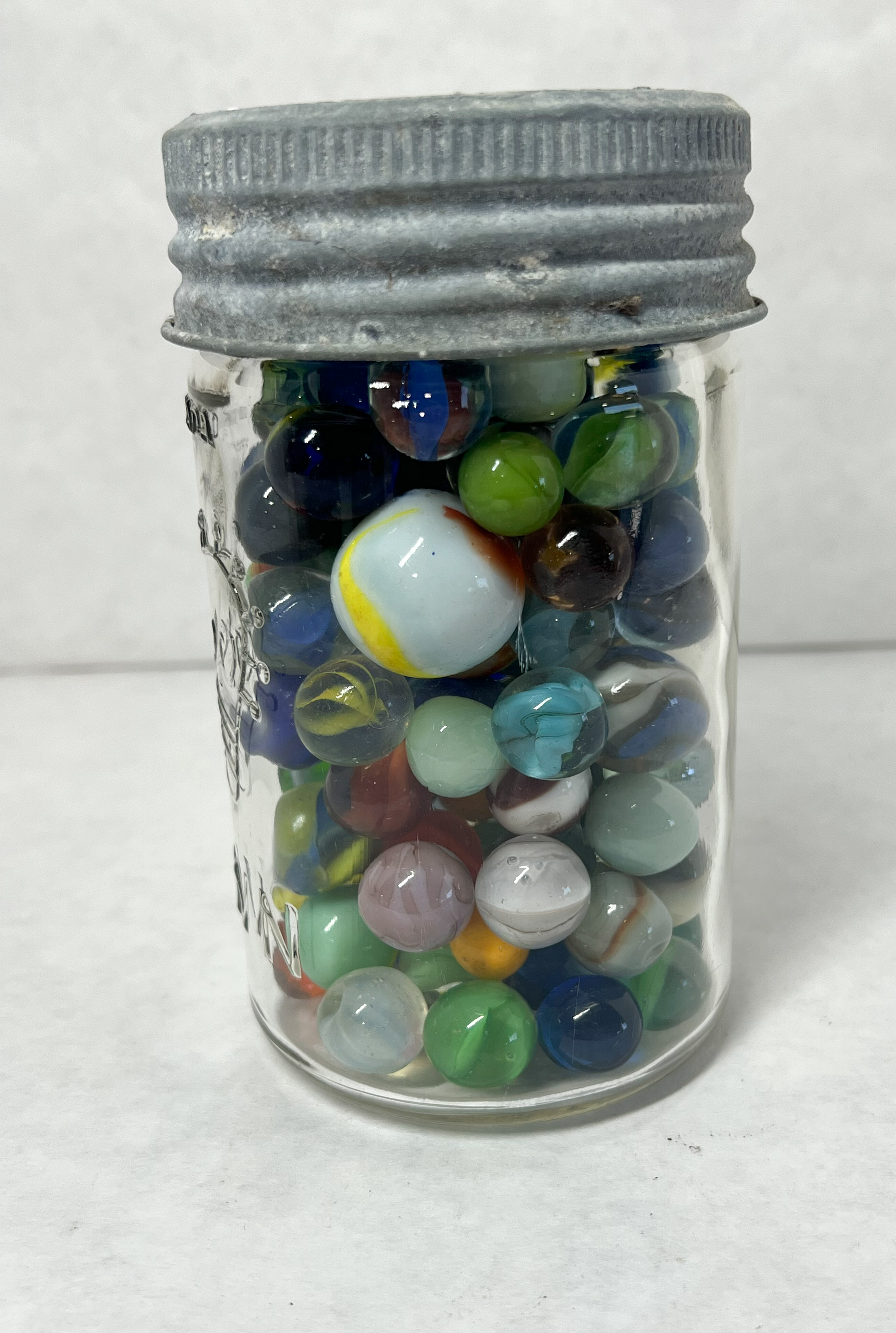 CROWN, MARBLES AND JAR, 20TH CENTURY