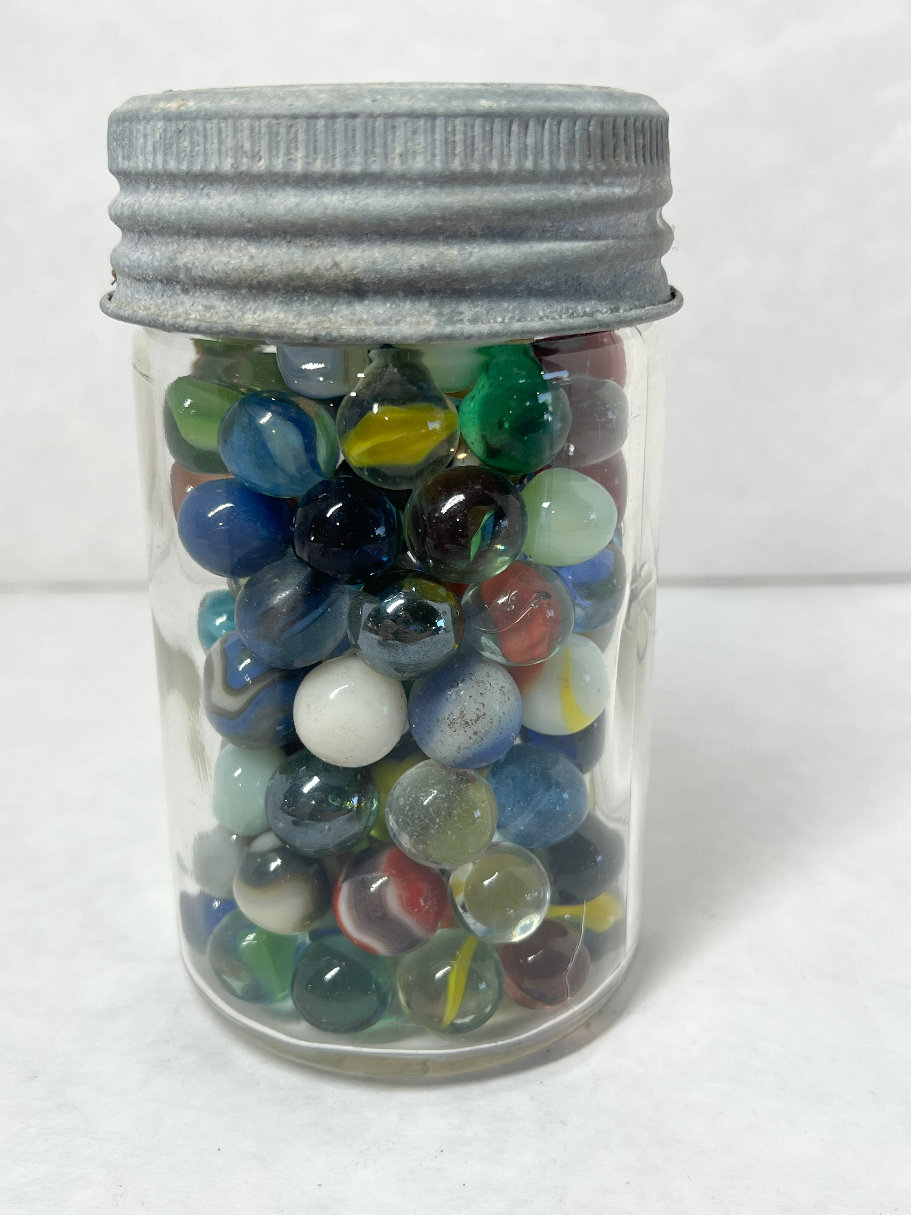 CROWN, MARBLES AND JAR, 20TH CENTURY