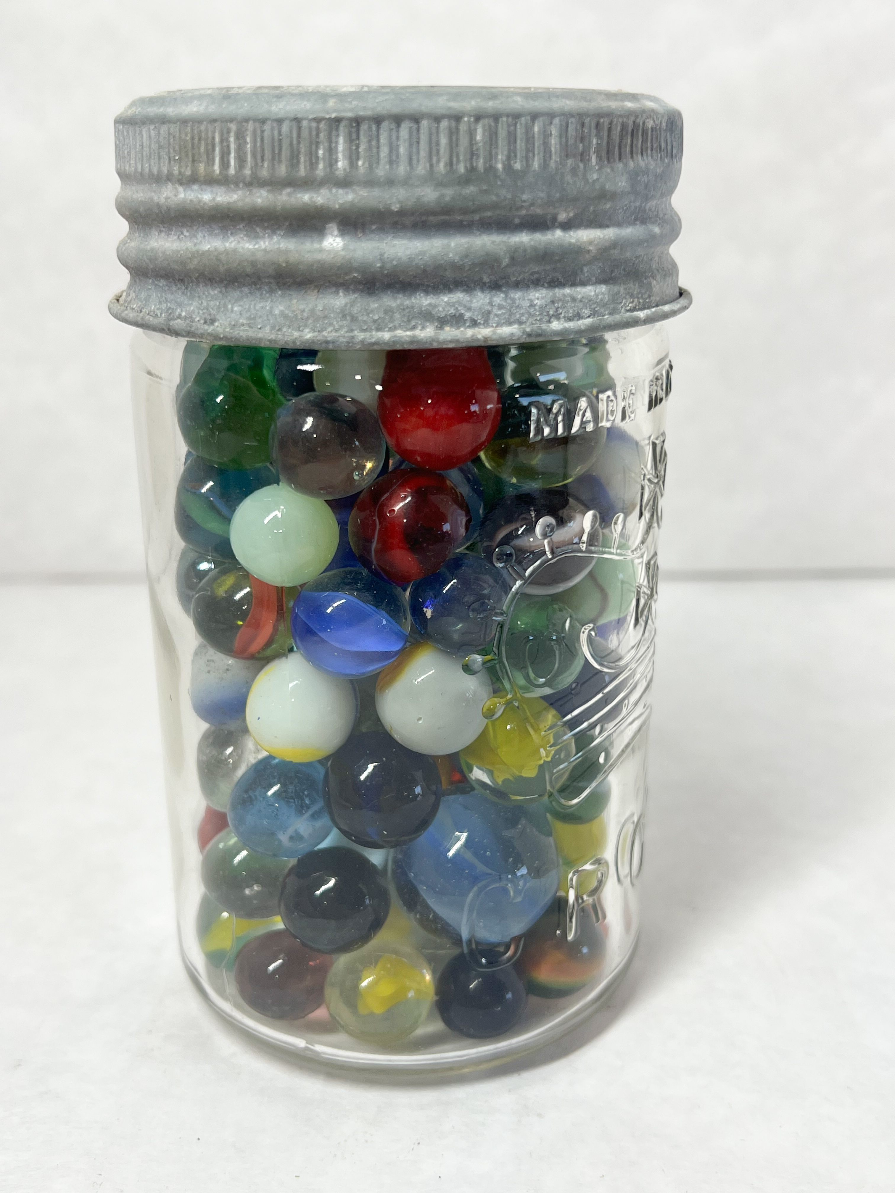 CROWN, MARBLES AND JAR, 20TH CENTURY