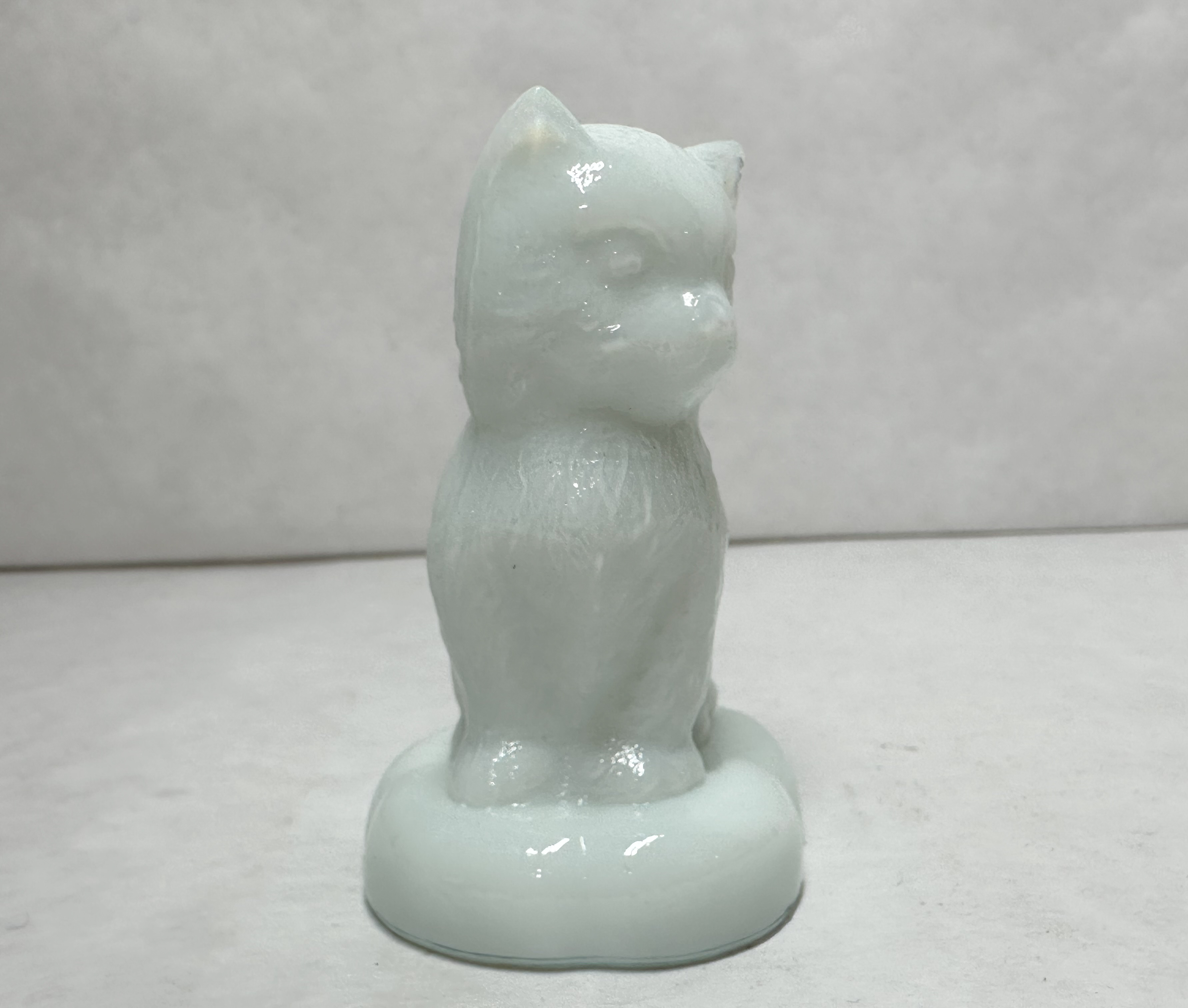 BOYD MILK SITTING KITTEN ON PILLOW