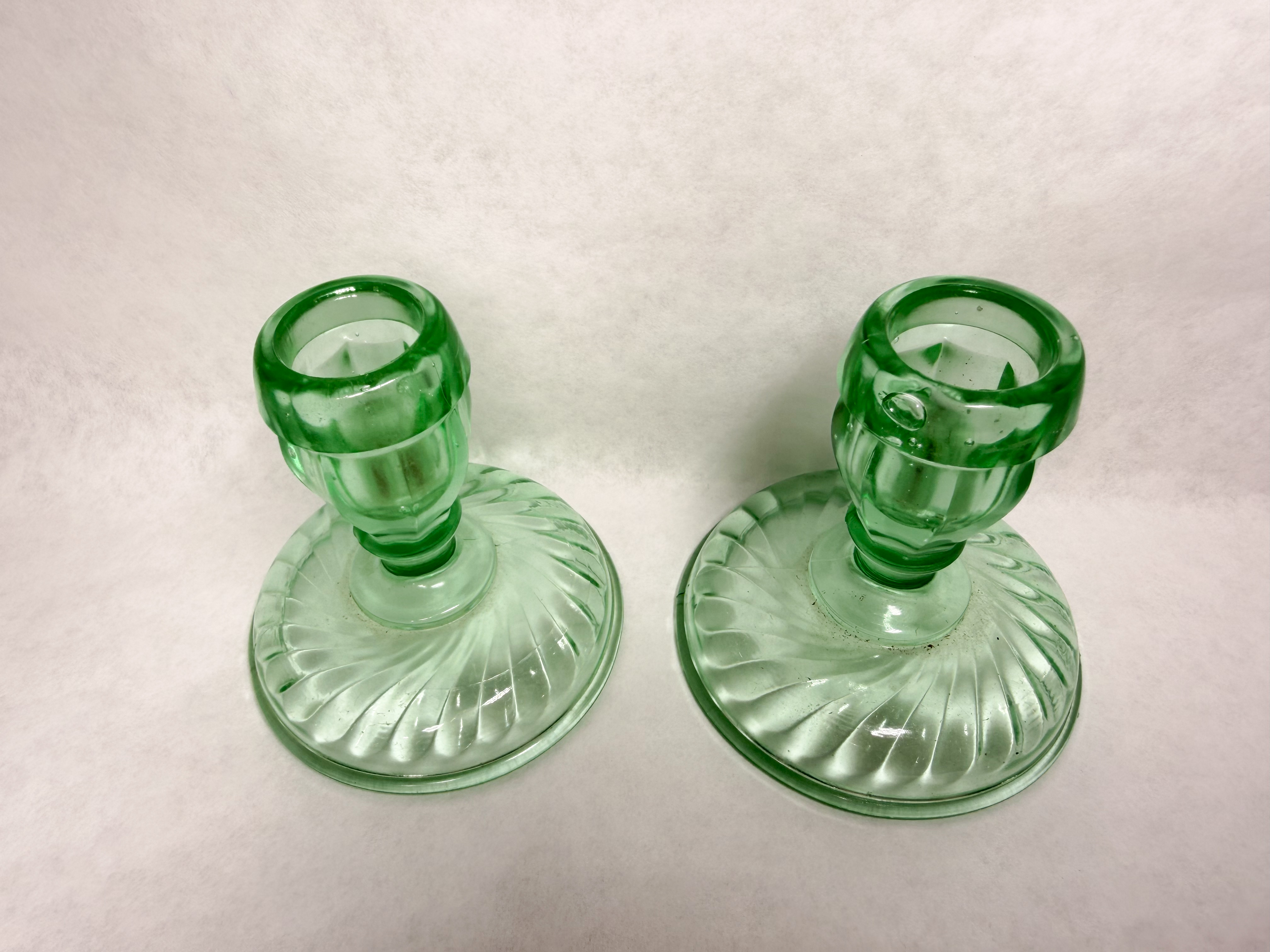PAIR OF GREEN URANIUM GLASS SWIRL CANDLESTICKS