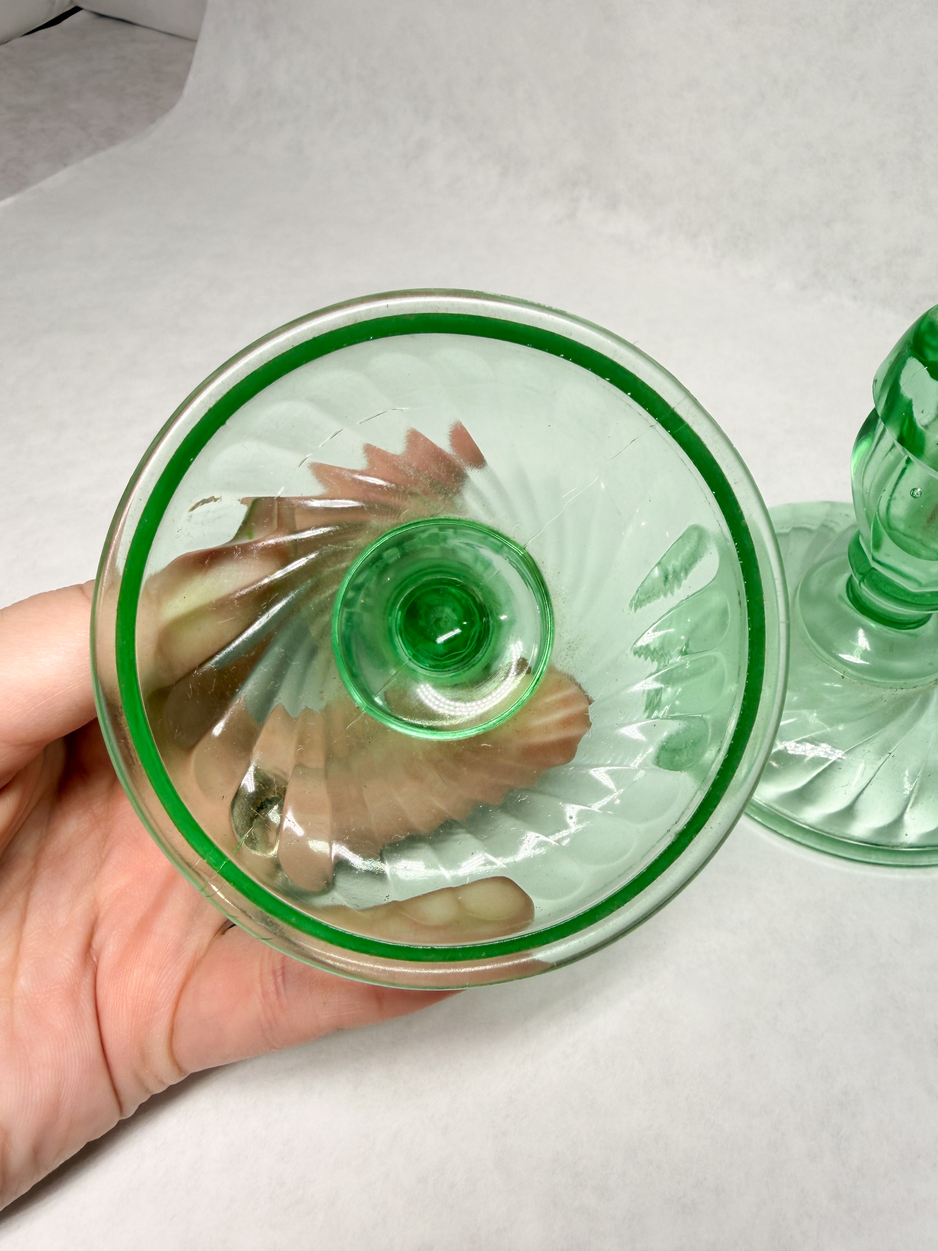PAIR OF GREEN URANIUM GLASS SWIRL CANDLESTICKS