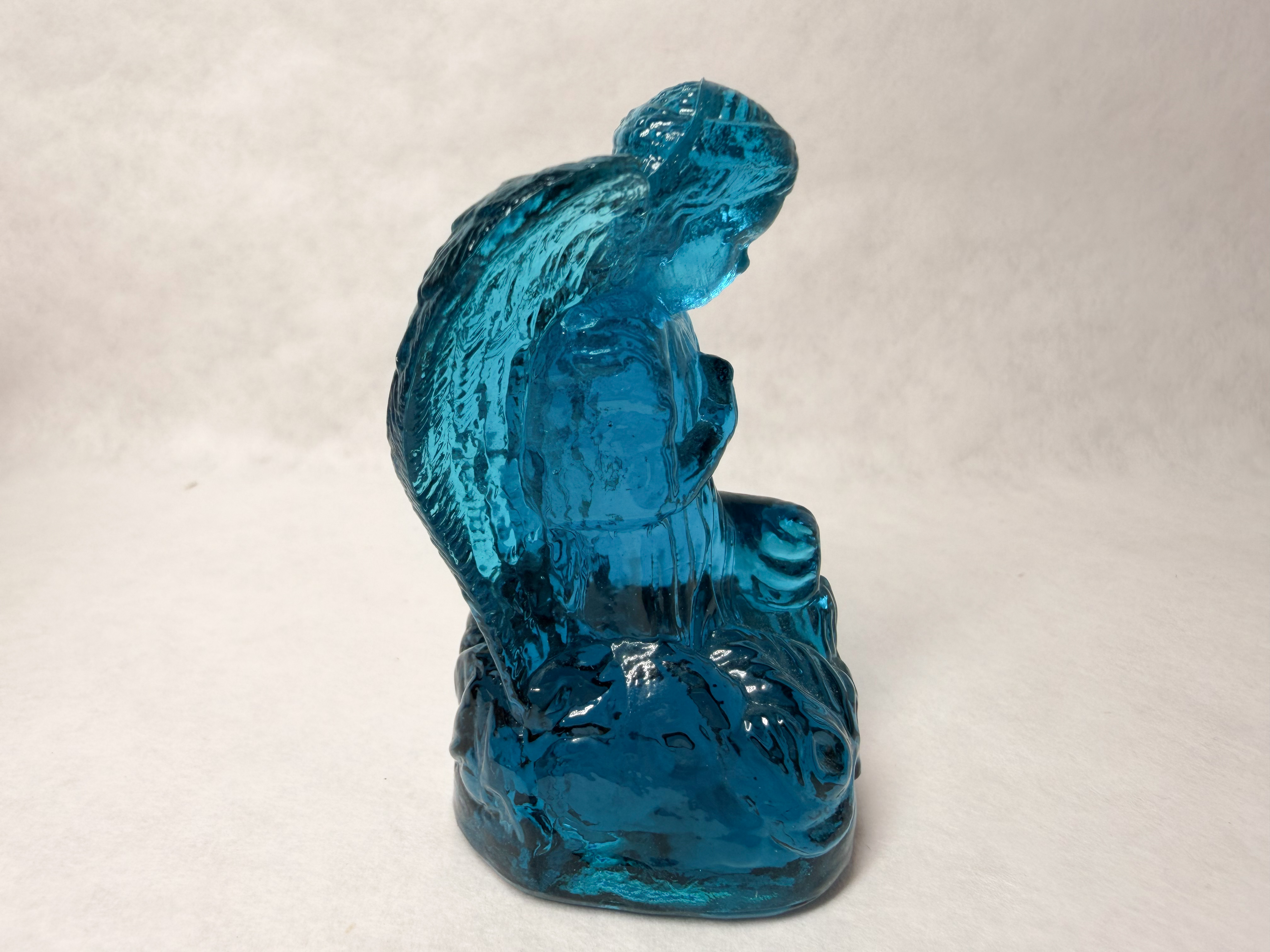 BOYD BLUE GLASS PRAYING ANGEL, LATE 20TH CENTURY