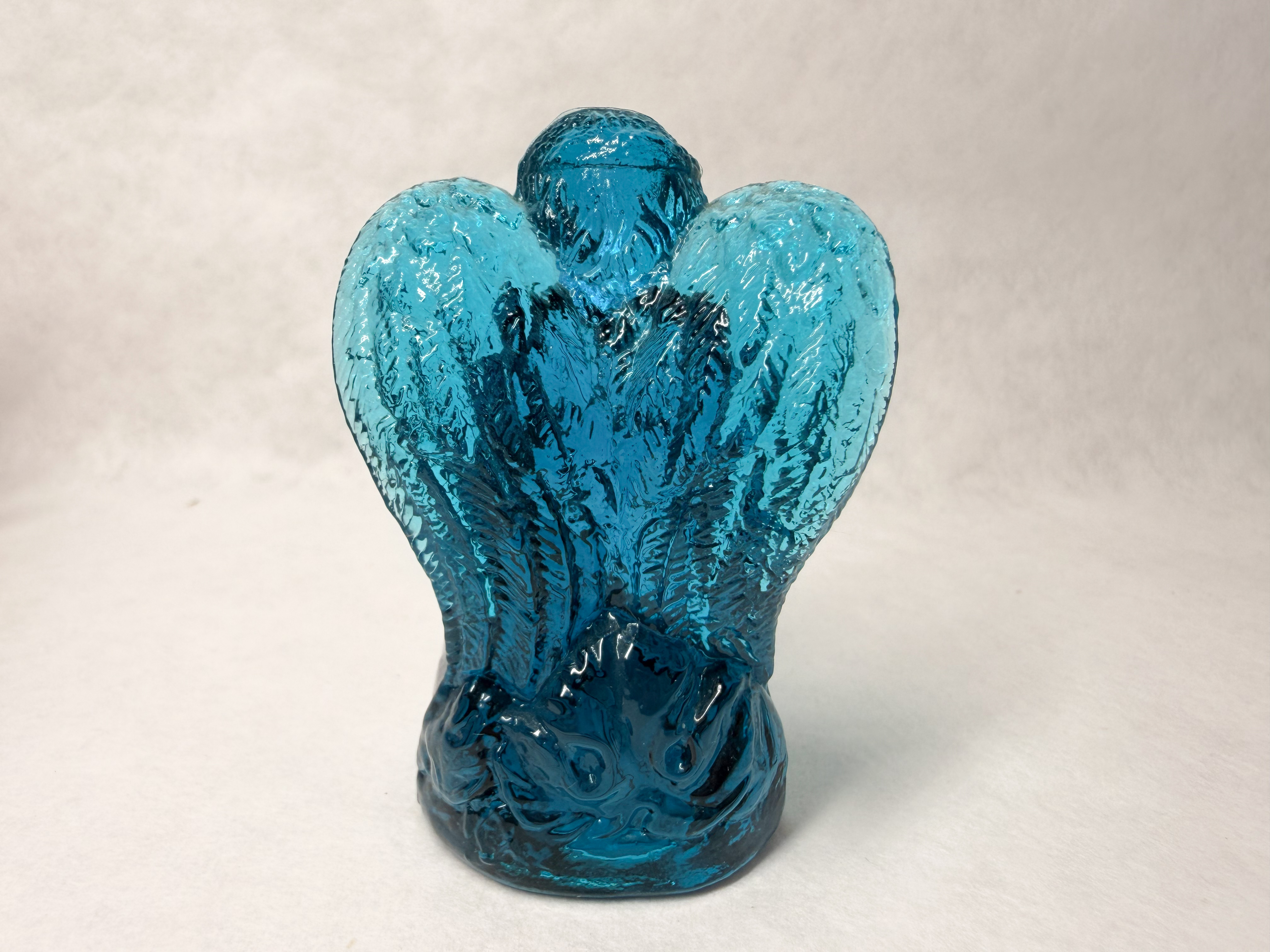 BOYD BLUE GLASS PRAYING ANGEL, LATE 20TH CENTURY