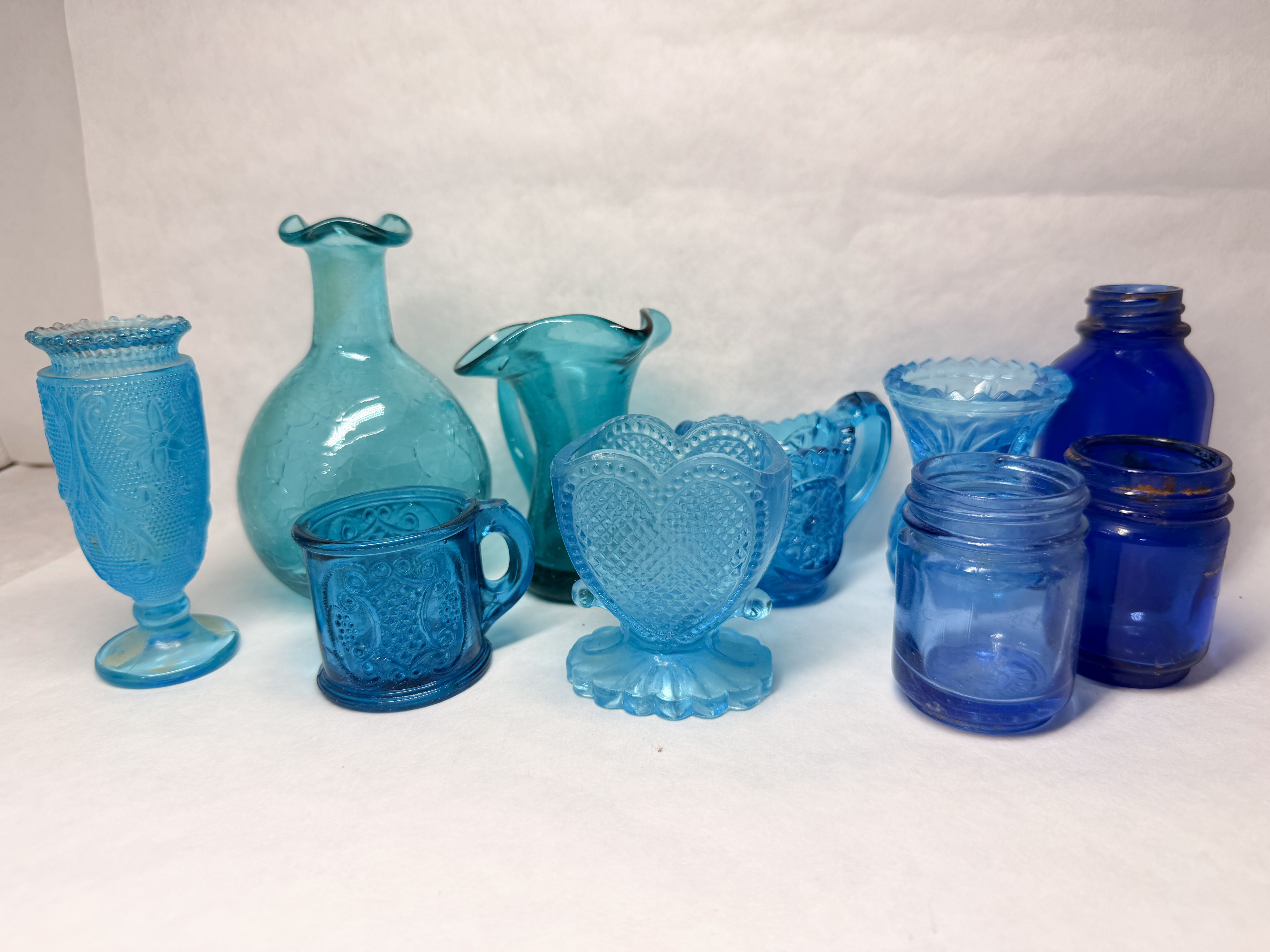 COLLECTION OF TEN BLUE GLASS PIECES
