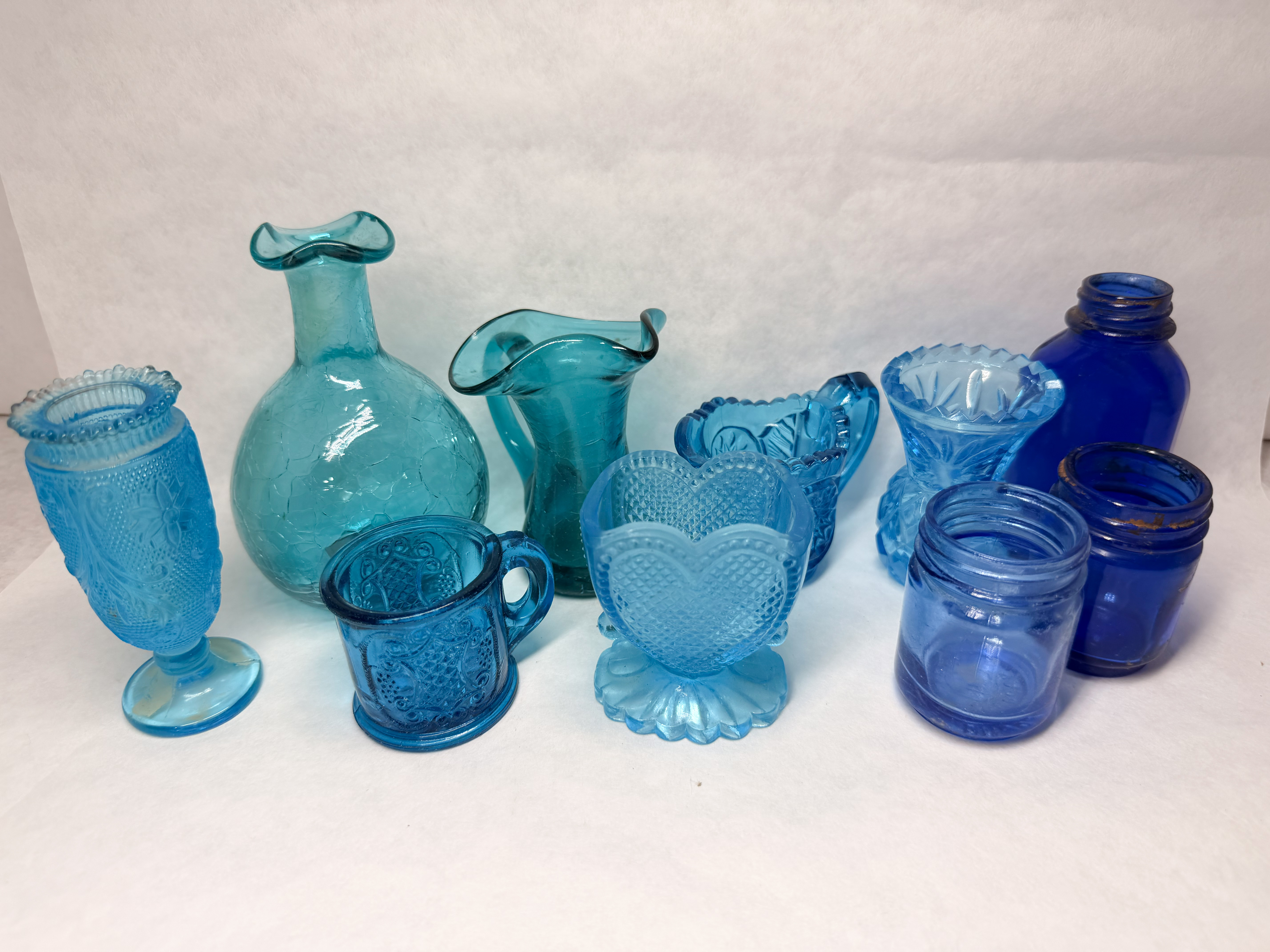 COLLECTION OF TEN BLUE GLASS PIECES