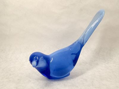 FENTON BLUE GLASS BIRD, 1980S. A blue glass bird of happiness figurine produced by the Fenton 