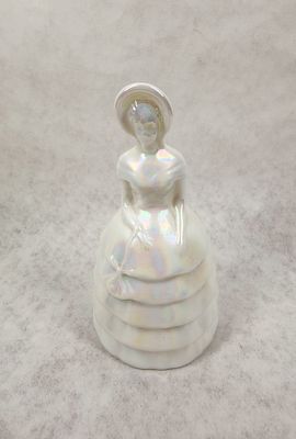 WHITE GLASS SOUTHERN BELLE FIGURINE. Iridescent white glass figurine depicting a Southern Belle 