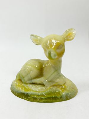 BOYD YELLOW SLAG BINGO DEER. A decorative slag glass figurine depicting a reclining fawn on a 